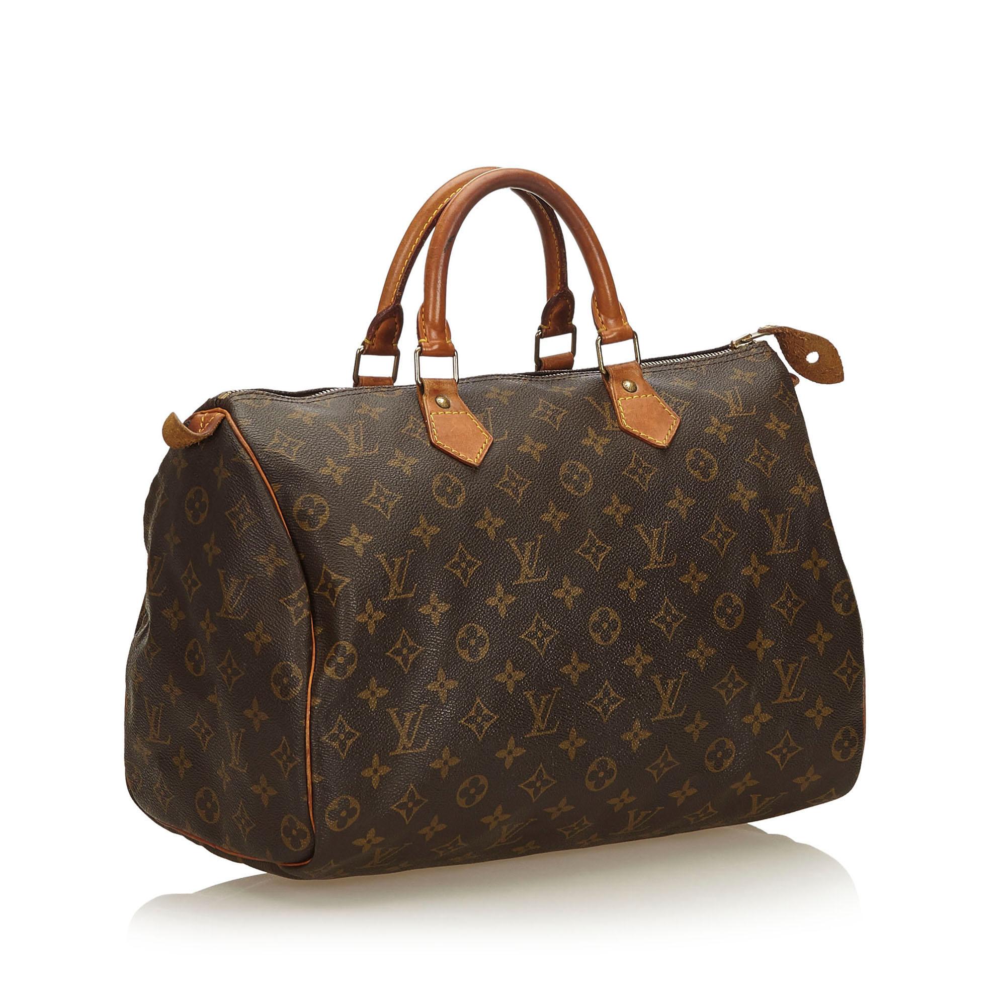 The Speedy 35 features the Monogram canvas, vachetta handles and trim, a top zip closure, and an interior pocket.

It carries a B condition rating.

Dimensions: 
Length 23.00 cm
Width 35.00 cm
Depth 18.00 cm
Hand Drop 10.00 cm

Inclusions: No longer