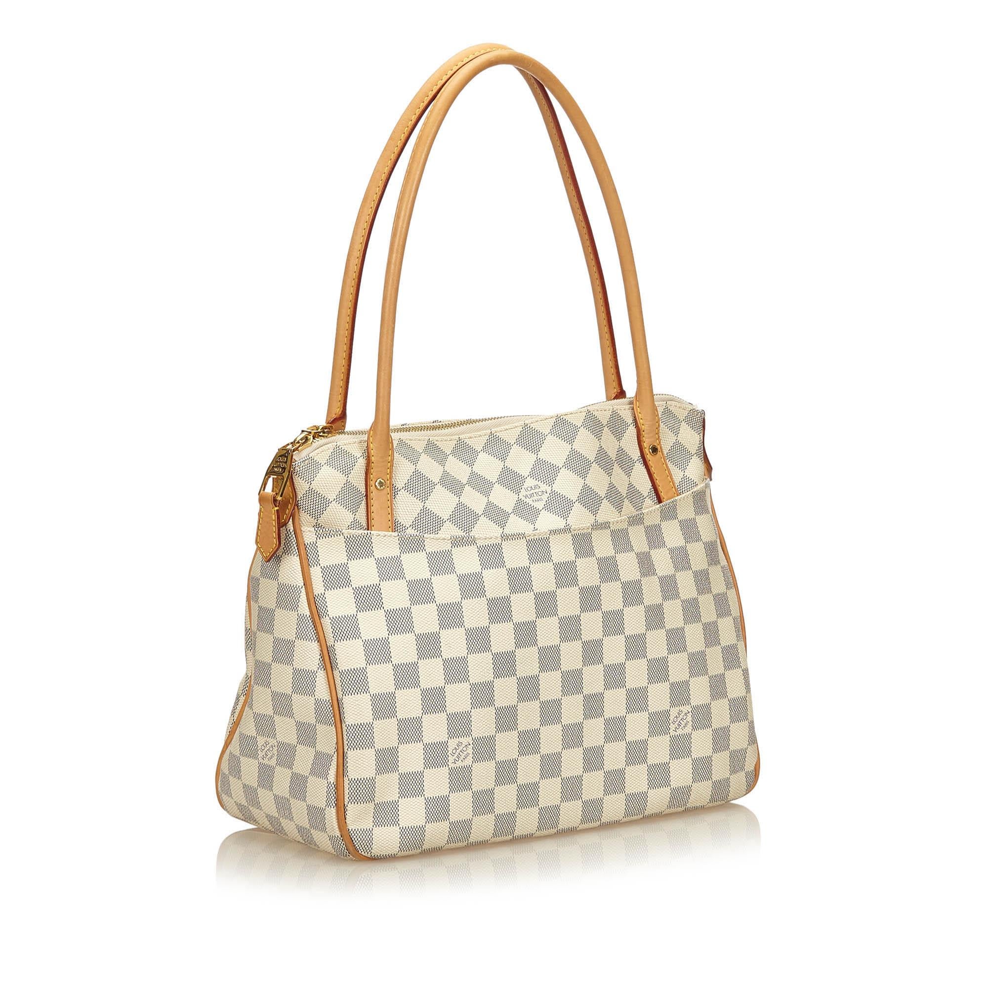 The Figheri PM features a damier azur canvas body, rolled leather handles, top zip closure, and interior pockets.

It carries a AB condition rating.

Dimensions: 
Length 27.00 cm
Width 33.00 cm
Depth 15.00 cm
Shoulder Drop 21.00 cm

Inclusions: No
