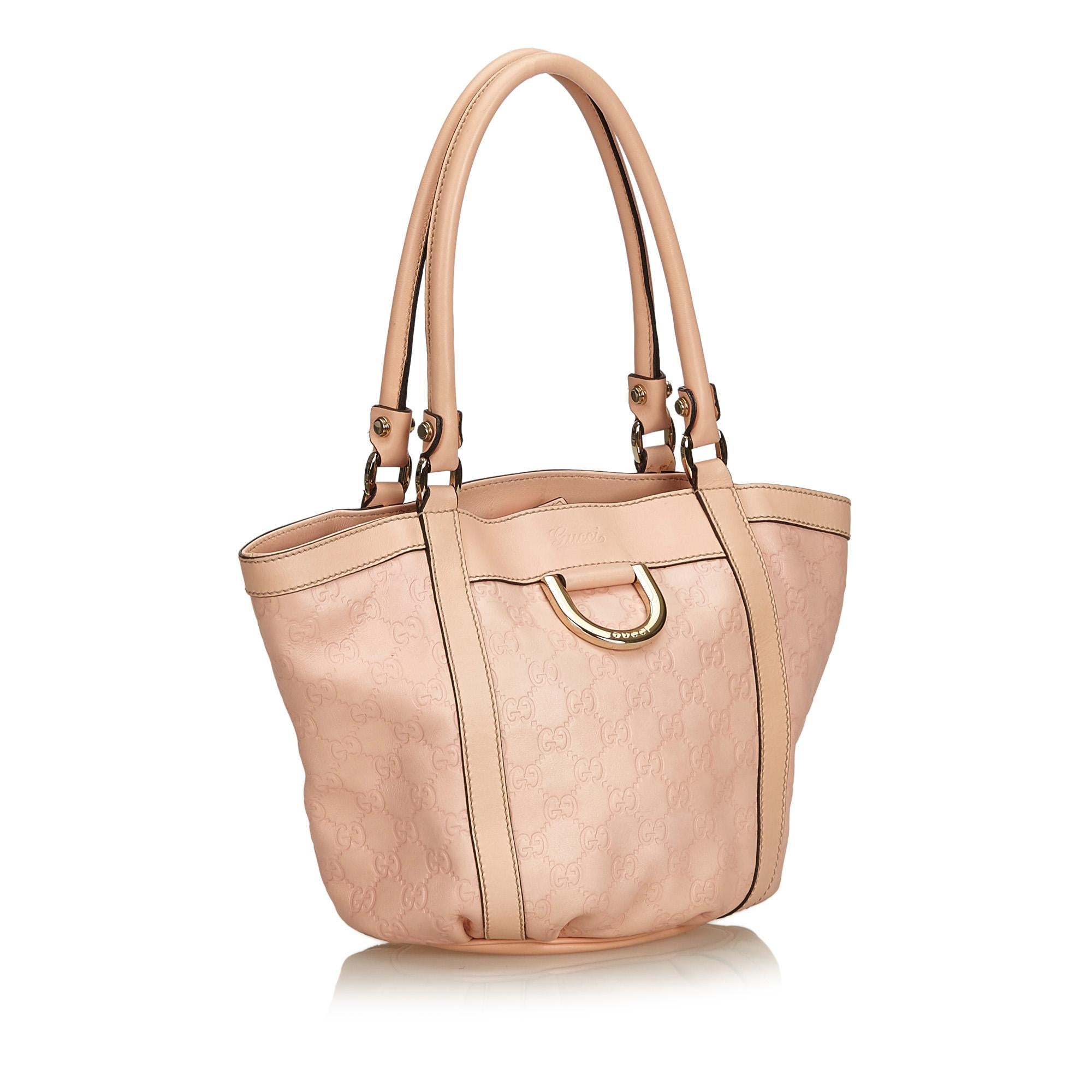 This tote bag features a leather body, rolled leather handles, open top, and interior zip and slip pockets.

It carries a B+ condition rating.

Dimensions: 
Length 25.00 cm
Width 34.00 cm
Depth 9.00 cm
Shoulder Drop 19.00 cm

Inclusions: No longer