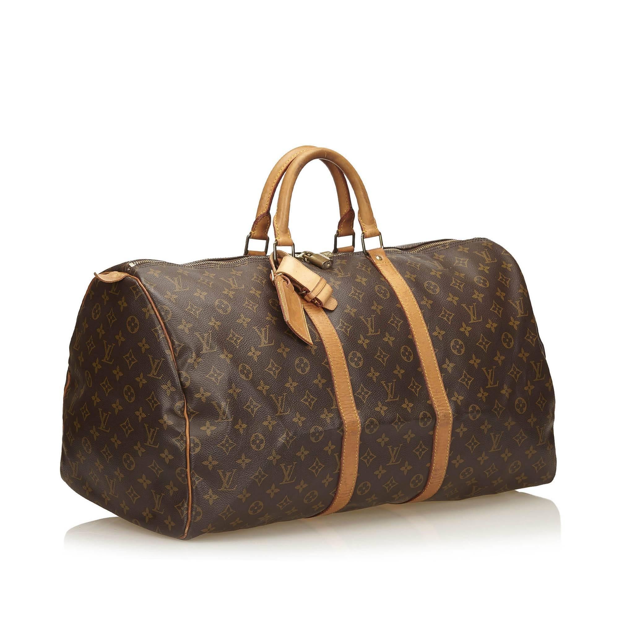 The Keepall 55 features a monogram canvas body, rolled leather handles and a top zip closure.