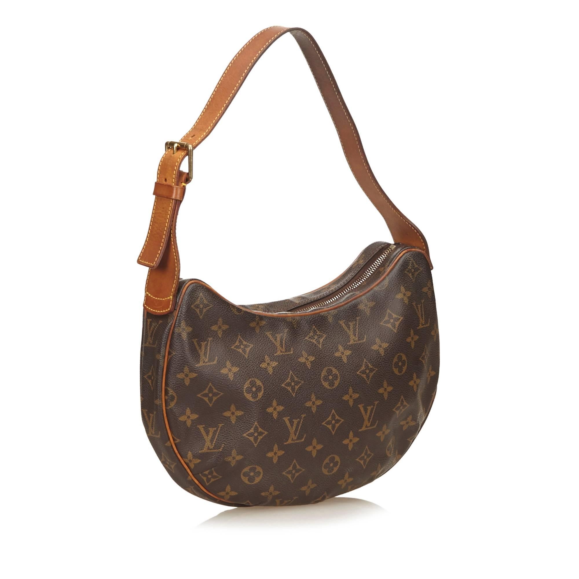The Croissant MM features a monogram canvas body, a leather shoulder strap, a top zip closure, and an interior slip pocket. It carries a B condition rating.

Inclusions: 
Dust Bag