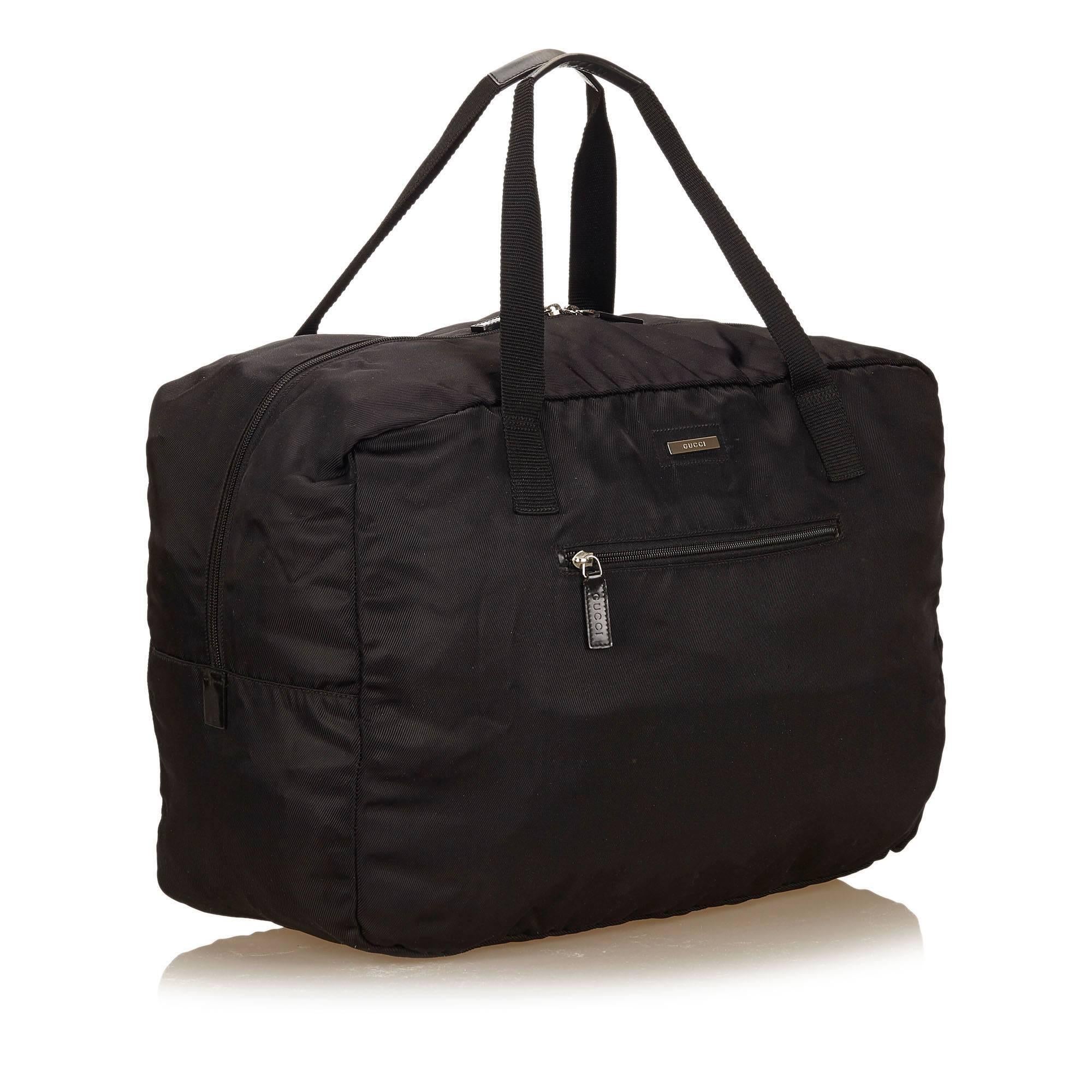 This duffel bag features a nylon body, front exterior zip pocket, flat nylon handles, top zip closure, and interior zip pocket. It carries a B+ condition rating.

Inclusions: 
None