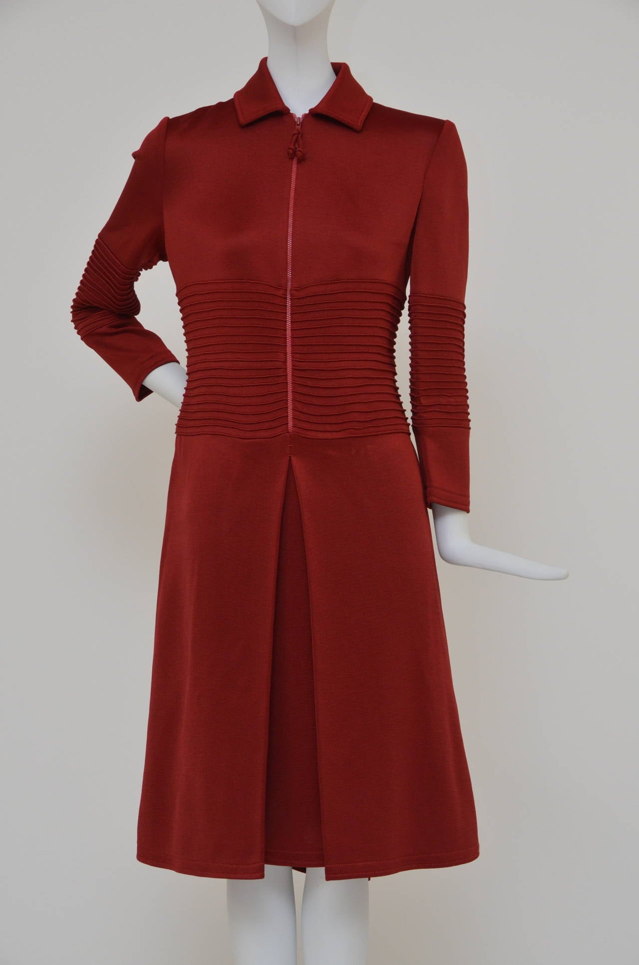 Look 7 from the Fall 2011 Chado Ralph Rucci runway show. This distinctive red Chado Ralph Rucci dress allows you to control your coverage from ladylike to racy with a clever front zip. For a poised and polished finish, style with red wrist gloves
