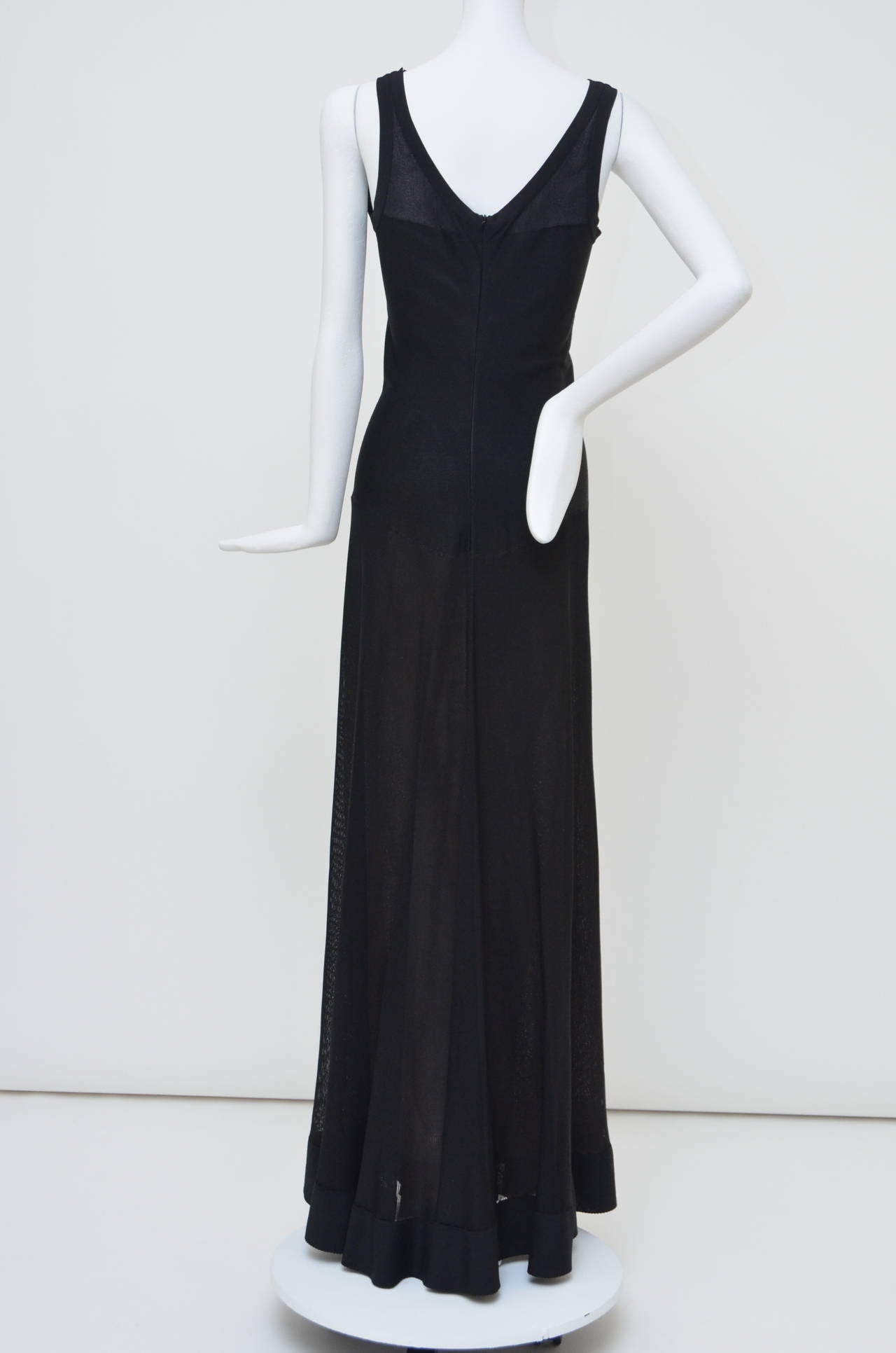 Azzedine Alaia  little black fine-knit dress. Sleeveless with  a boat-neck and a low back with skinny back straps, sweeping and gorgeous maxi length. This dress is incredibly dramatic and yet flattering  little black dress: it makes a statement but
