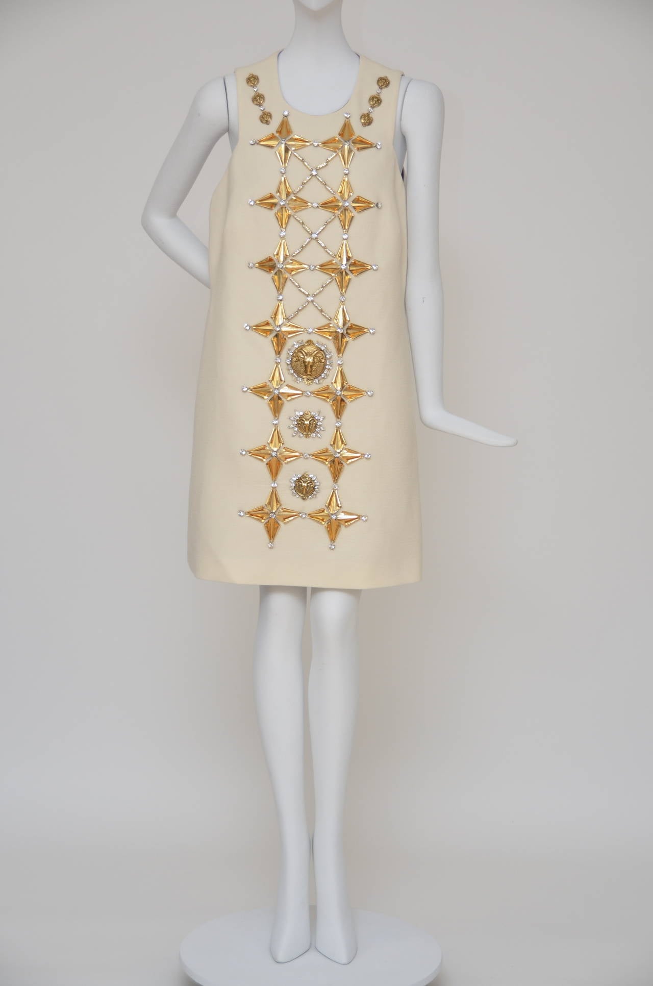 Fausto Puglisi embroidered wool crepe  dress embellished  with swarovski crystals, gold leaf and aries symbols on the front panel .  
Concealed back zip closure.  
Silk lining. Made in italy.
Size 42.Run small.New with tags.
Color in person is