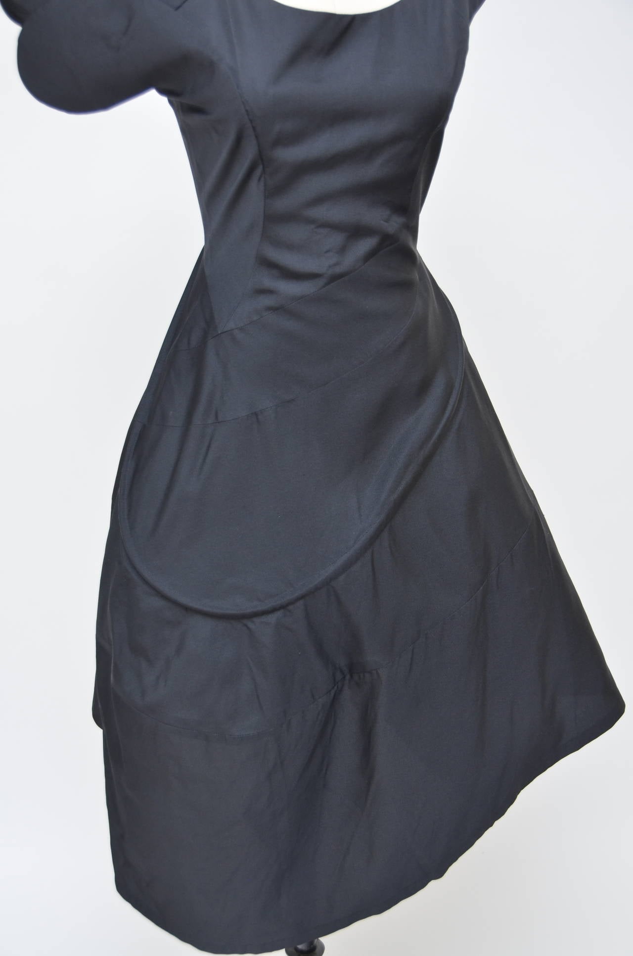 YOHJI YAMAMOTO  black  silk  swirl dress.

Red (similar) version of this dress was part of the 2011 exhibition 