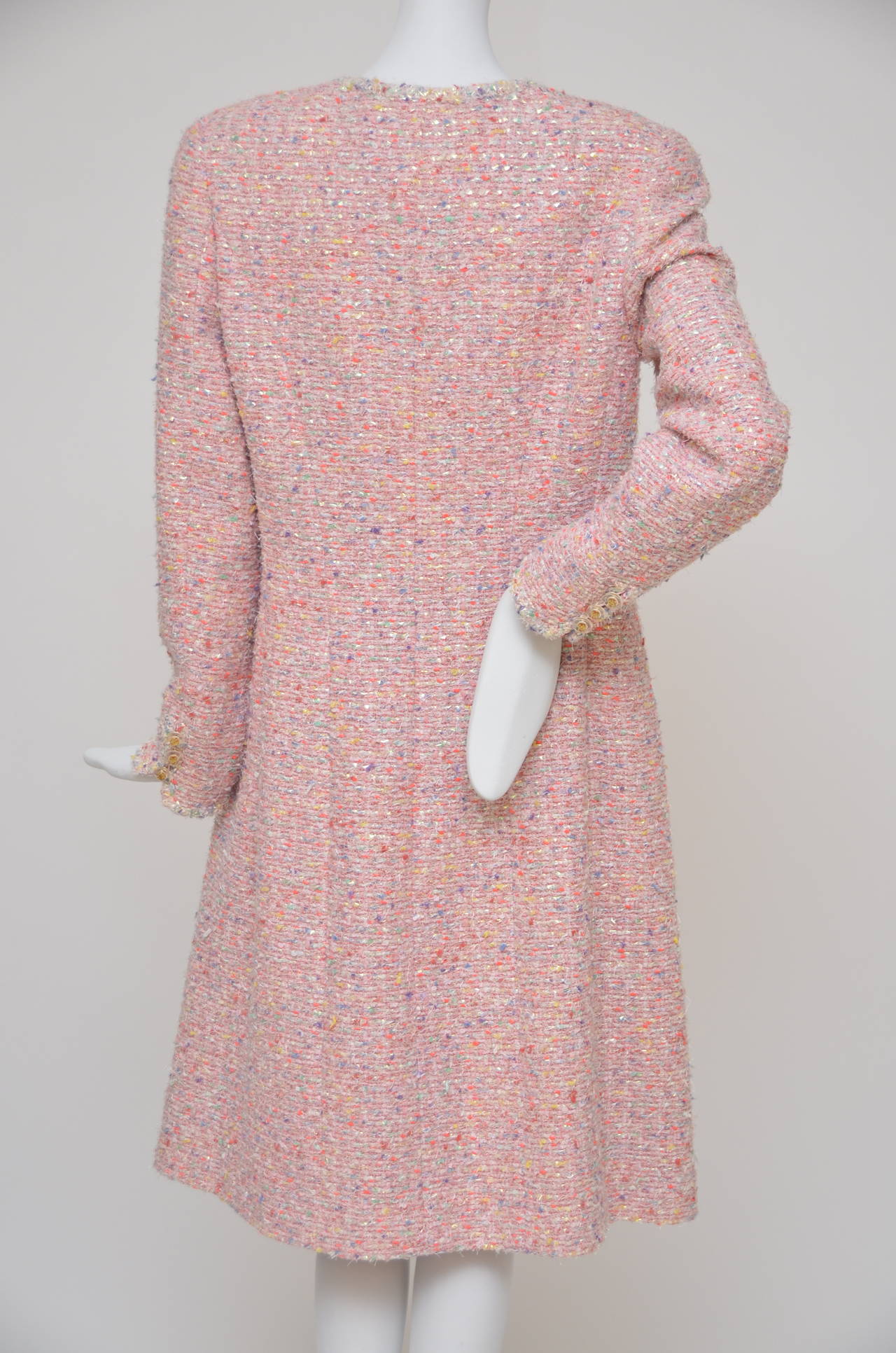Beautiful chanel pink  coat from 1997 runway.
Boucle fabric  with metallic fibers, round collar, four front flap pockets and front CC button closure. 
Measurements: Bust 36”, Waist 34”, Shoulder 16.5”, Length 40”
Fabric Content: 45% Cotton, 26%