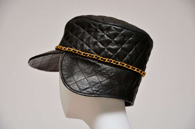Chanel Lambskin Leather Vintage Quilted Collectors Hat. 
New with original tag.
From  '94 collection.Size 58.
Vintage Chanel signature  gold tone chain with leather stitched all around the hat.
Final sale.