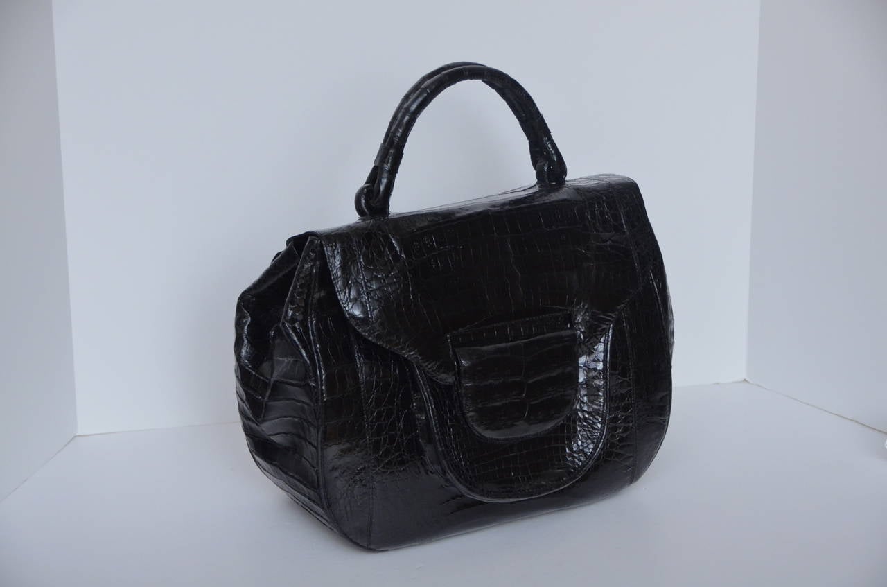 Nancy Gonzales black color crocodile large size handbag.
New condition.Beautiful spacious handbag.
Inside lined with beautiful suede leather.
Dust bag included.
Approximate measurements: L 12