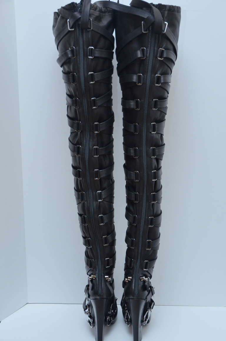 Nicholas Kirkwood for Rodarte Thigh High Bondage Boots .
New without box.Size 39.Made in Italy.
Boots have been photographed with leather straps wrapped around with leather inserted in each metal hook but straps can be done only on the front part