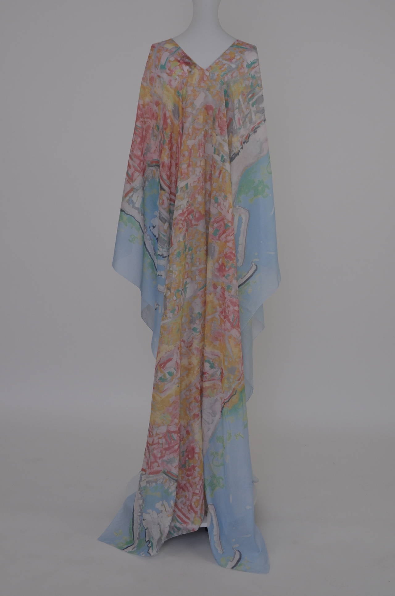 Gorgeous Sexy   Chanel kaftan from 2011 runway collection.Brand new without tags.
Sold out and impossible to find.Light blue with multiple color mix shades in watercolor print.
One size fits all.Tie closure in the front and large opening on the