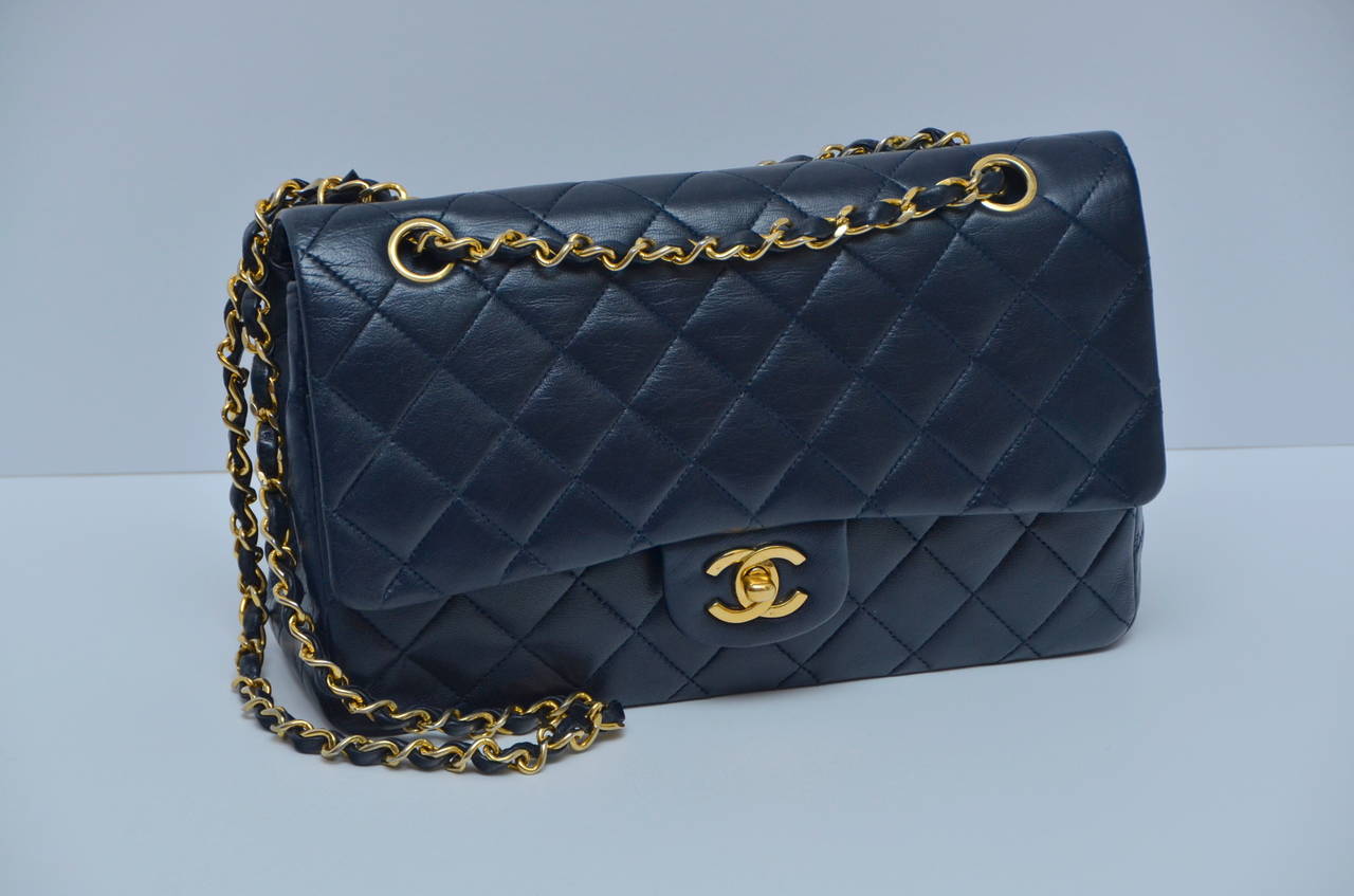 Chanel vintage medium size double flap handbag.
Lambskin leather.
Gold plated hardware.
Made in France.
Excellent vintage condition.
Hologram sticker inside peeled off but there is part of  sticker still left without any numbers.Lined in red 