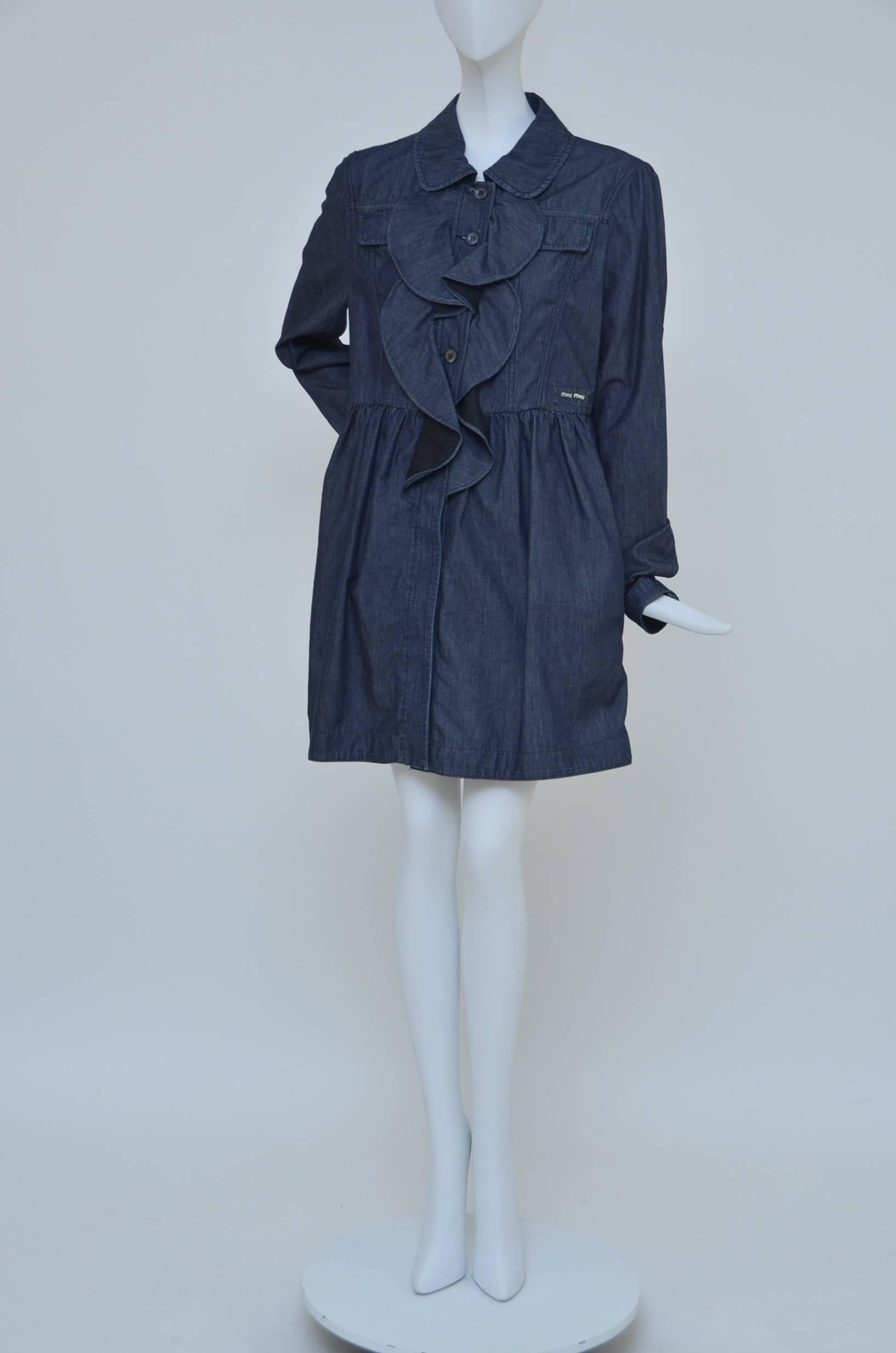 Miu Miu light denim fabric dress or coat.
Very versatile and could be worn as a dress or coat.
4 pockets in the front (2 small on the top and 2 big by waist).
New with tags.Size 44.Made in Italy.
Approx. measurements :Waist17