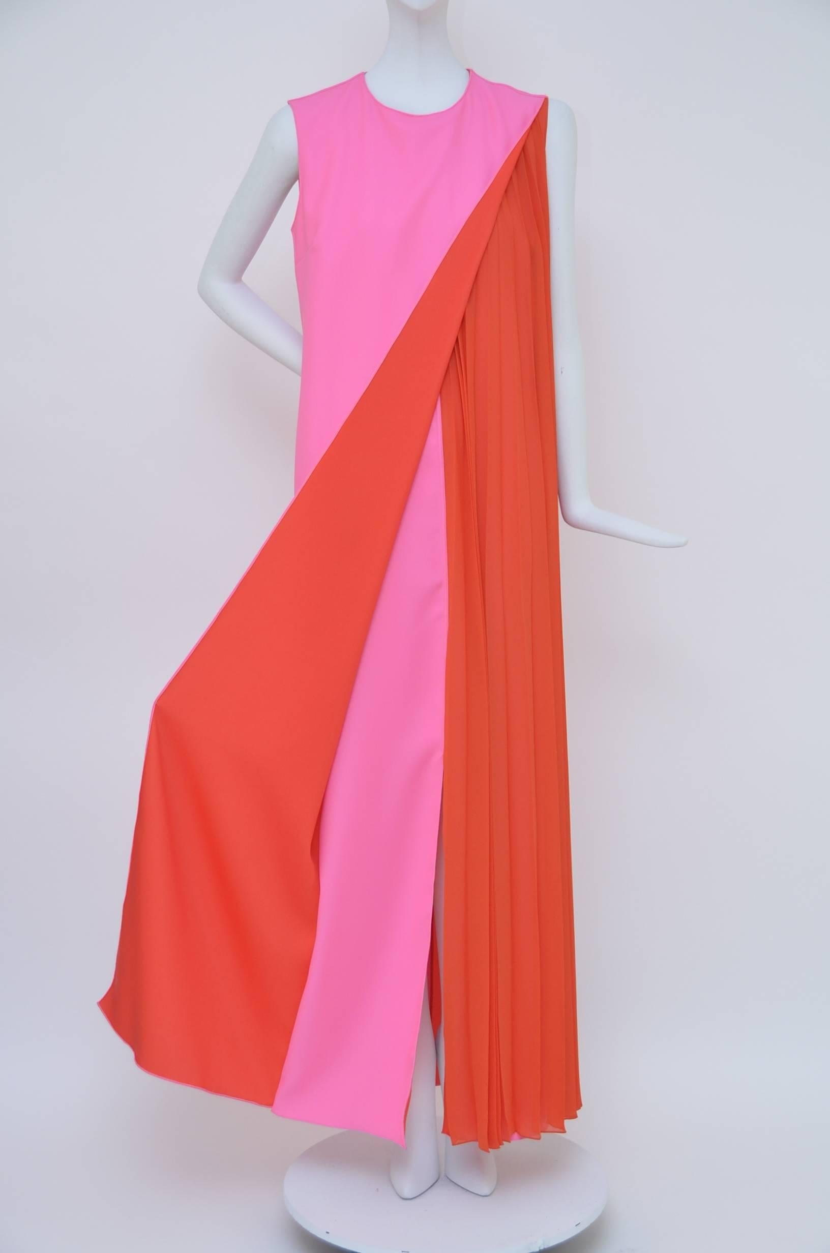 Christian Dior neon/pink dress.
Sleeveless with red pleated insert.
Excellent mint condition.
Size 4US.

FINAL SALE.