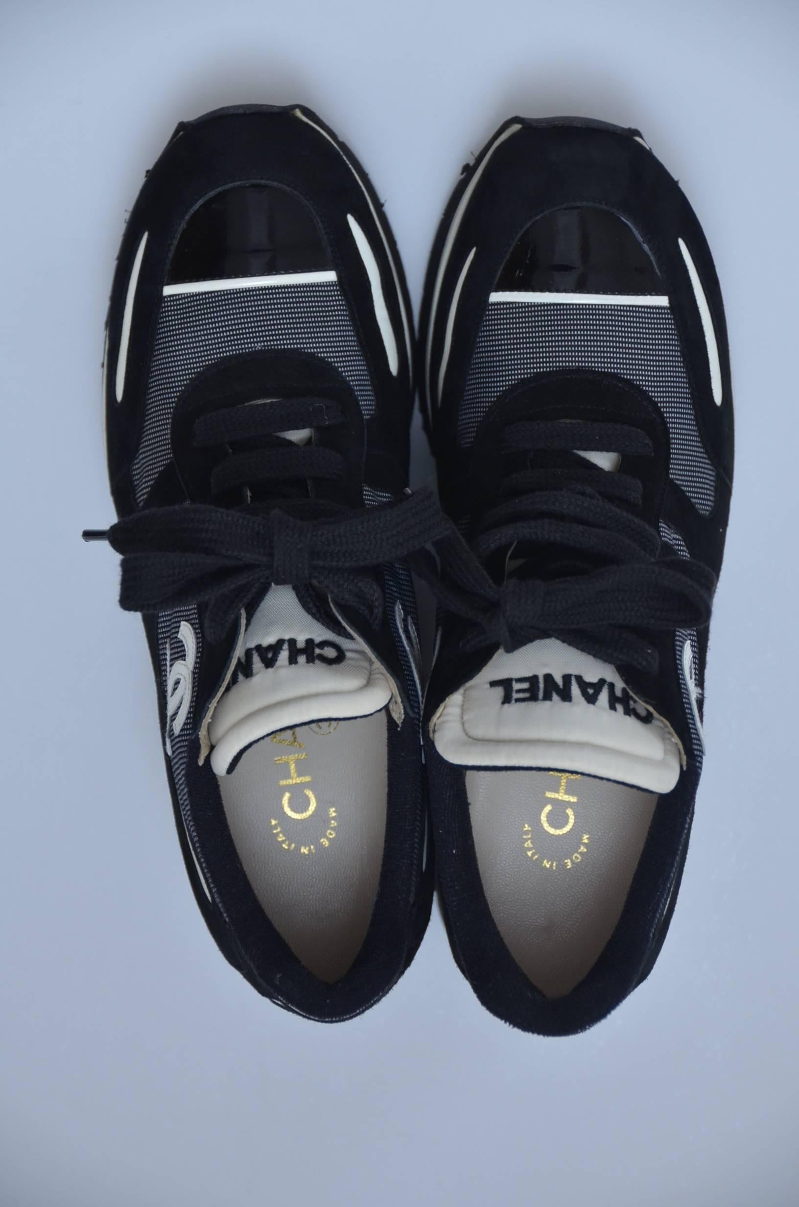 Chanel platform shoes/sneakers .
Brand new ,never worn with dust bags.
Purchased in 1997.
Inside lined in leather,outside :black suede leather with fabric mix with off white CC embroidered on all 4 sides.
Stylish and unique sneakers from  Chanel