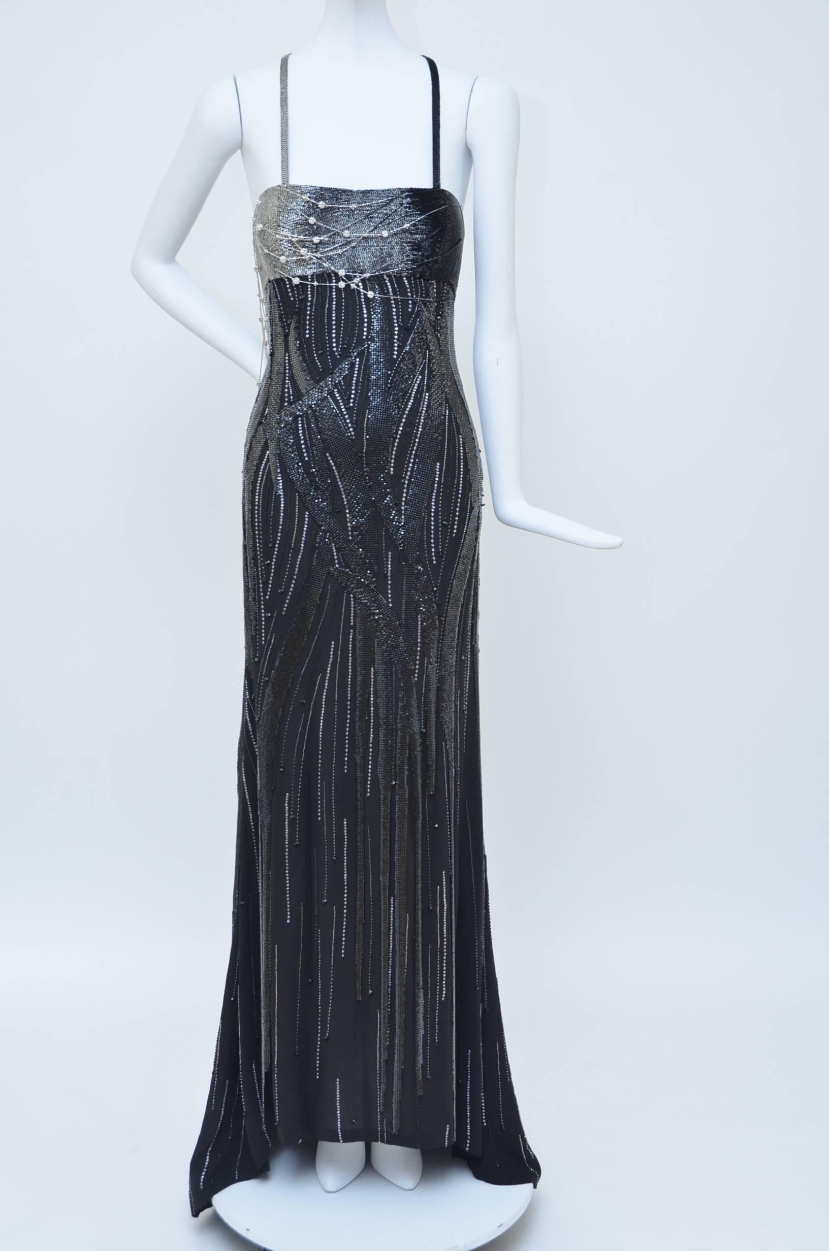 Very extravagant black silk  Gianni Versace Couture Atelier Dress from 1990's.
Amazing construction with Oroton chain mail sewn all over the dress and 