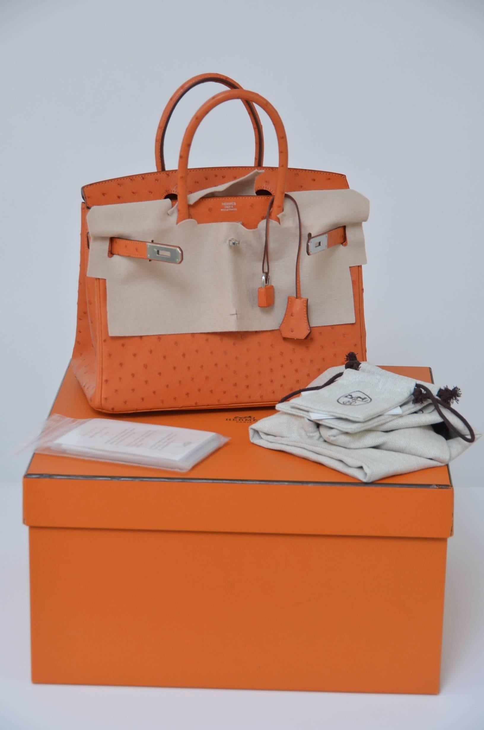 Hermes Tangerine 30cm in Ostrich with palladium hardware.
Tonal stitching, front toggle closure  and double rolled handles. The interior is lined in Tangerine chevre with one zip pocket with an Hermes engraved zipper pull and an open pocket on the