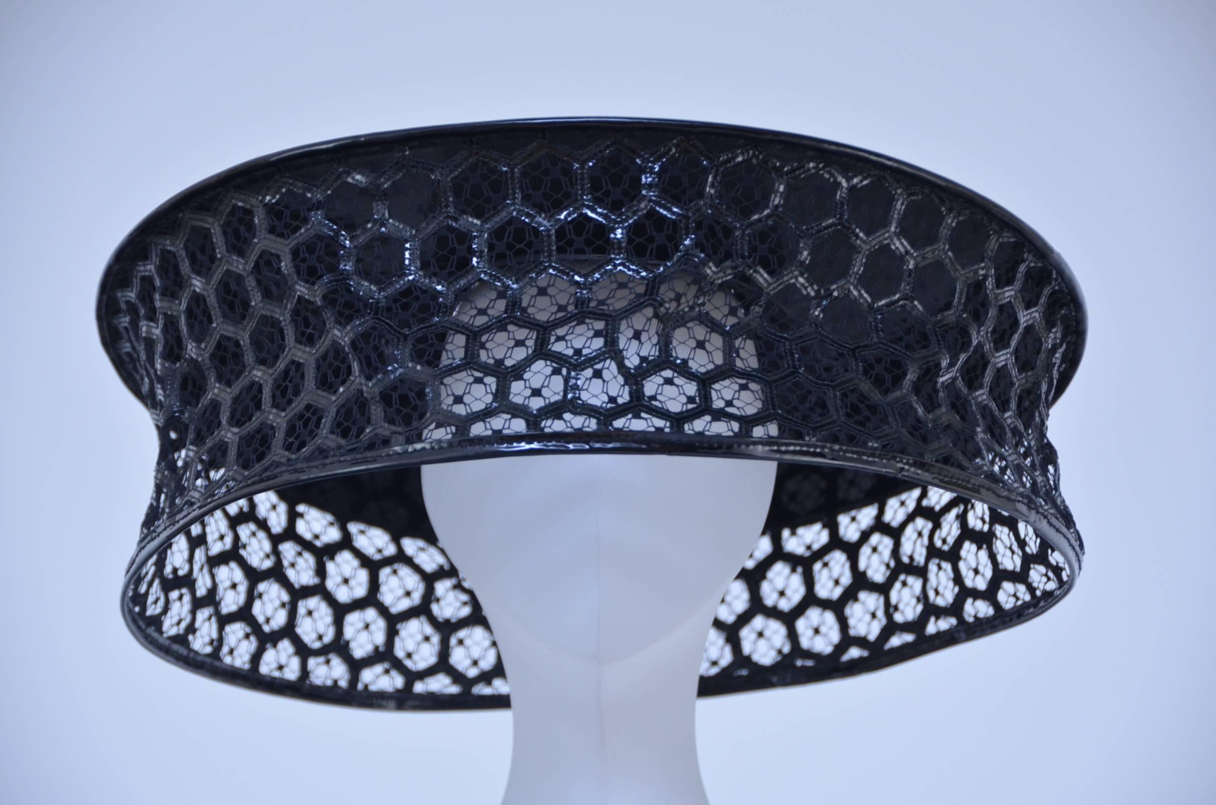 Sarah Burton's  awe-inspiring designs exhilarate the avant-garde aesthetic, fashion's most avid followers has been  seen wearing this  beekeeper-inspired hat. Boasting the inimitable honeycomb patterning that was interwoven throughout the entire