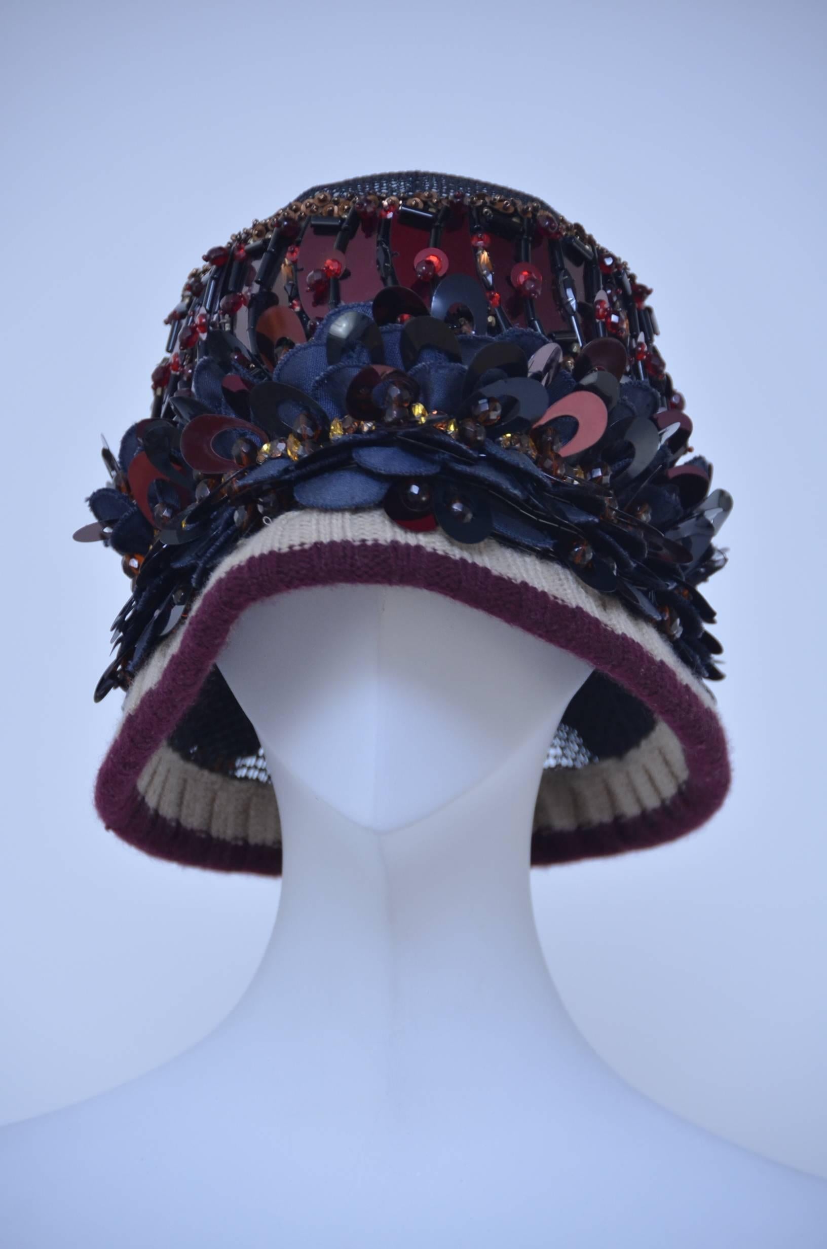 Prada embellished cloche hat.
Numbered 187.
2005 collection.
Bottom of the hat has wire inside the fabric to support the wear and shape.
Excellent mint condition.
Made in Italy.

FINAL SALE.
