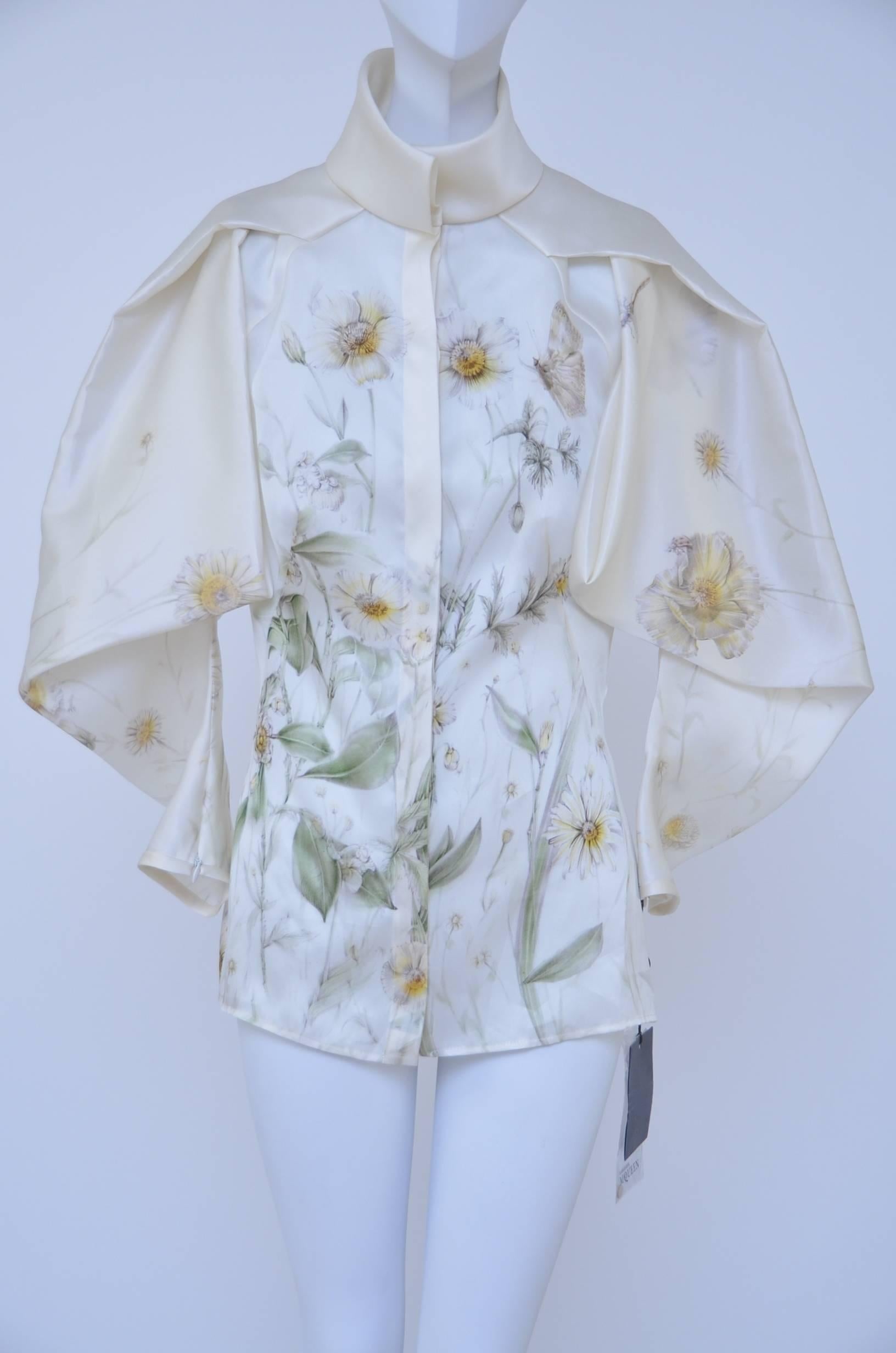 Alexander McQueen silk shirt from runway 2009 collection.
Worn with skirt on the runway.
Fabric 100% silk with beautiful flowers print done in silk fabric twist and instantly recognizable Alexander McQueen style.
New with tags .Size 40.

FINAL