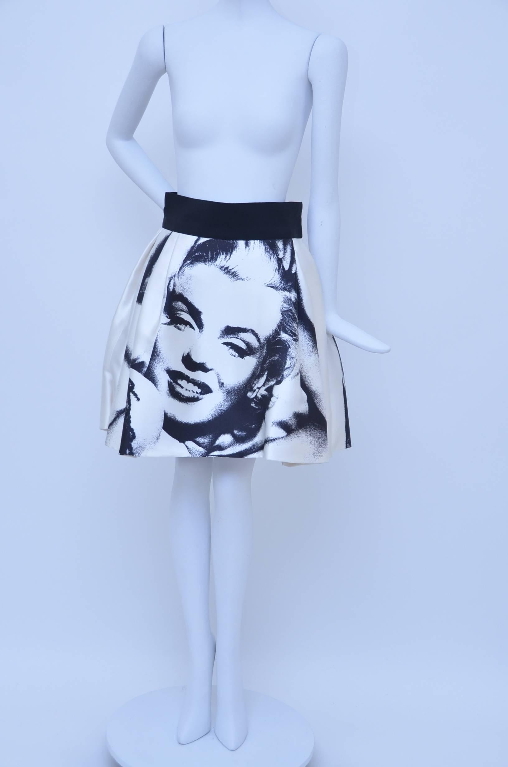 Dolce & Gabbana Marilyn Monroe printed skirt.
Heavy silk fabric doubled up and black skirt underneath  to create more fullness and volume.
Measurements: Waist 26”, Hip 44”, Length 19.5”
Fabric Content: 100% Silk, Lining: 60% Silk, 40%