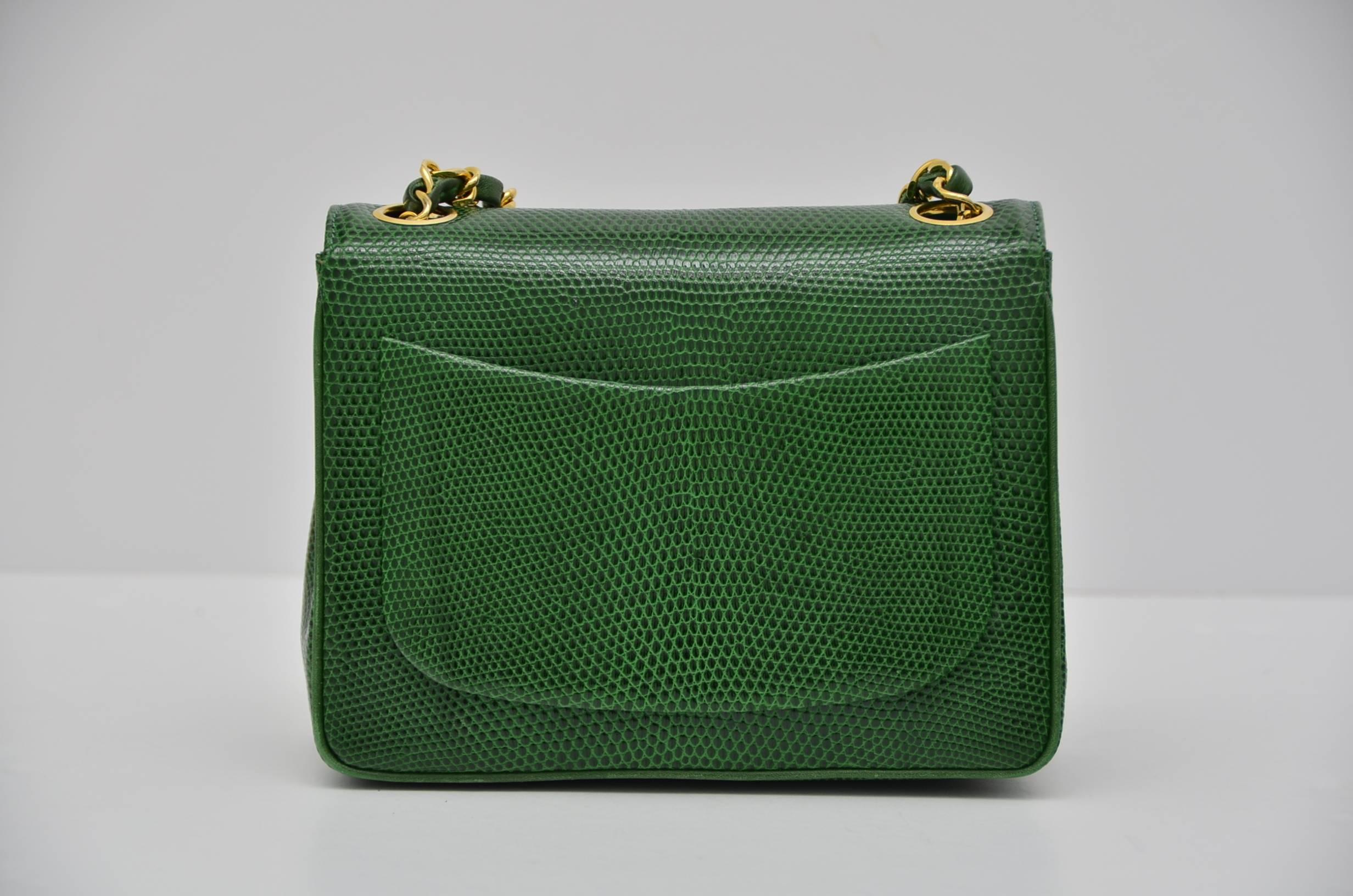 Chanel very rare  hard to find mini size handbag.
Emerald green color in person.
Excellent vintage condition.Lizard skin in excellent condition with nice and shiny finish.Few minor scratches inside.
Gold tone hardware in excellent