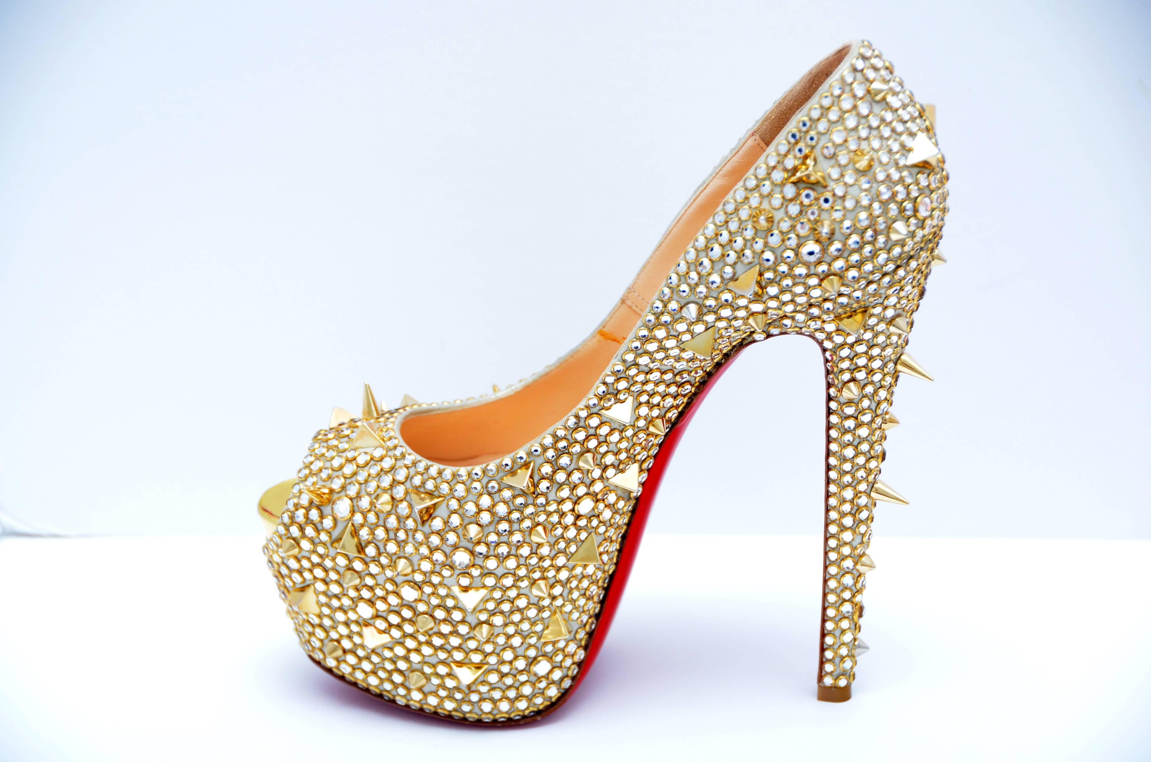 Gold Christian Louboutin Highness Strass Embellished Peep-toe Platform Pumps from the  Khloe Kardashian  closet .
She wore these  at 