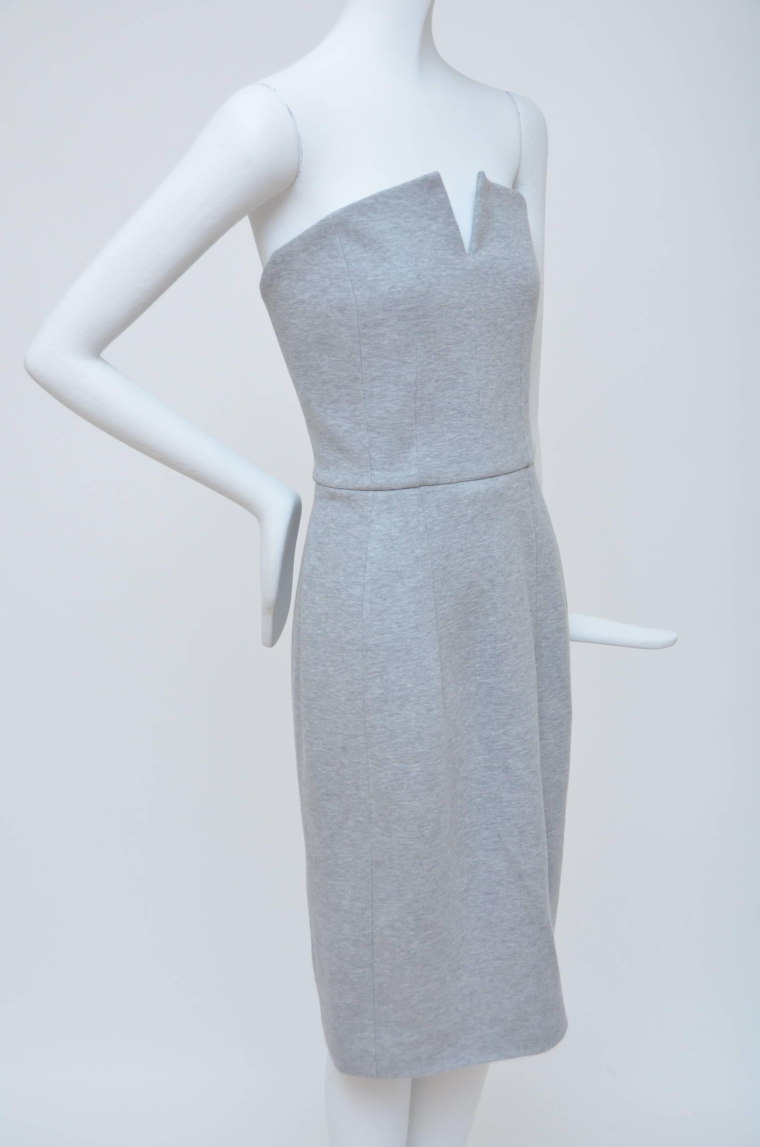 Grey Yves Saint Laurent strapless  dress with tonal stitching throughout and concealed zip closure at back.
Seen on the best dressed as Rihanna,Kate Moss ,Gwyneth Paltrow,Julianne Mooree.....
Unlimited possibilities to wear this special
