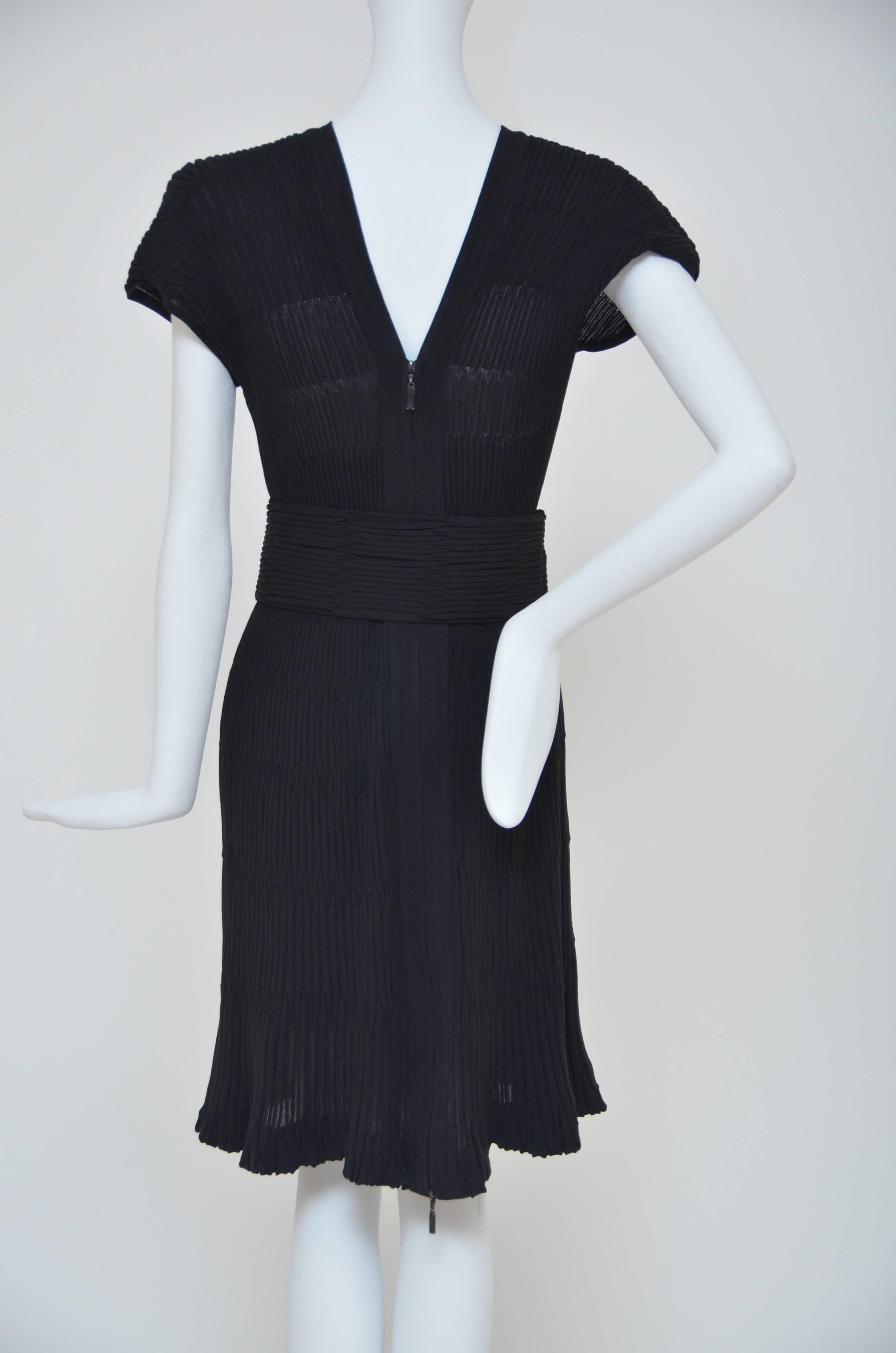 Chanel black knitted dress with removable belt.
Size 42.
Excellent mint condition.
Fabric is slightly stretchy.Zipper closure.
Made in France.

FINAL SALE.