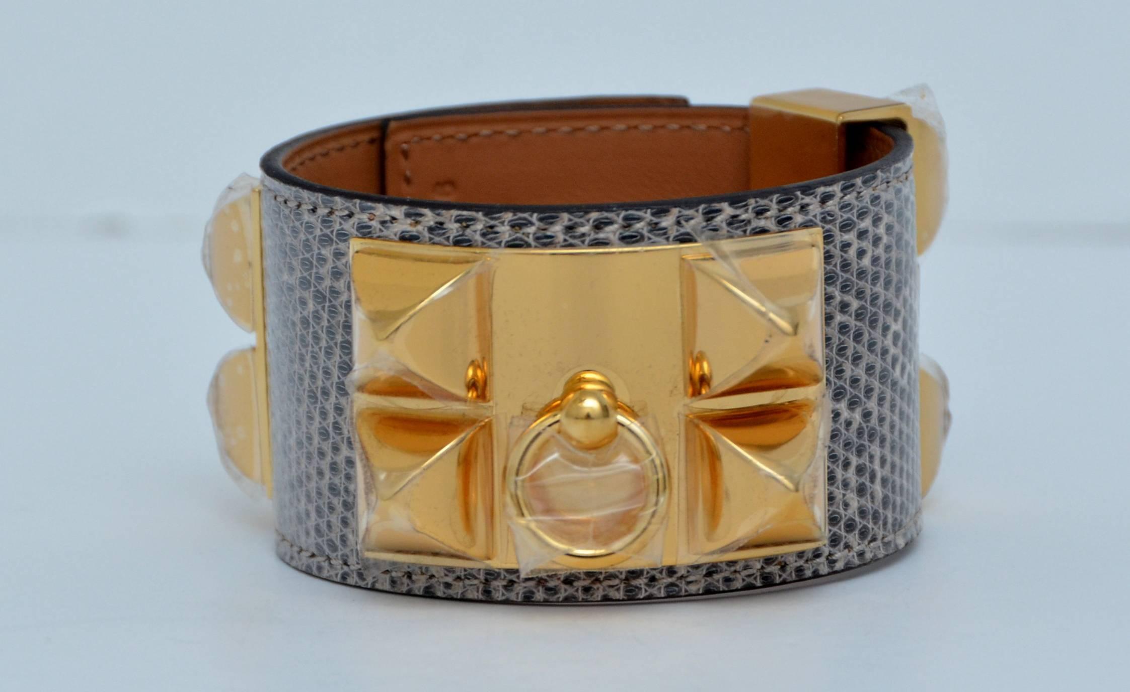 HERMES Lizard Collier De Chien CDC Bracelet  Ombre.
Gold tone hardware.
Size S.
Made in France.
Purchased and never used.All plastic attached on the hardware.
New with box and Cites .

FINAL SALE.