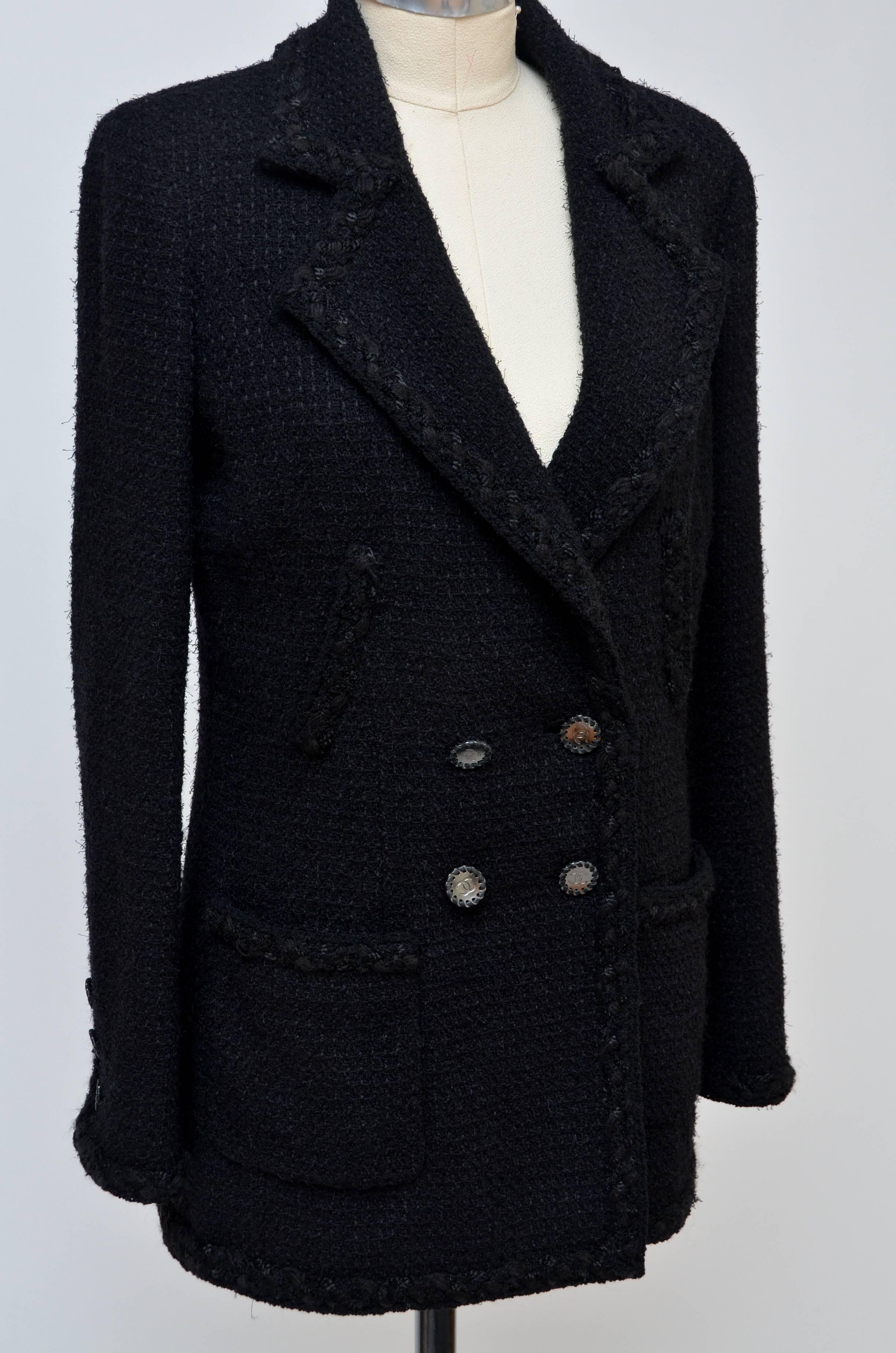 Impossible to find Chanel black tweed jacket.
Very rare and highly desirable black jacket.
This beauty is from the same collection as famous black jacket that every woman want in their closet...
Made of exact same fabric and same  CC  metal 