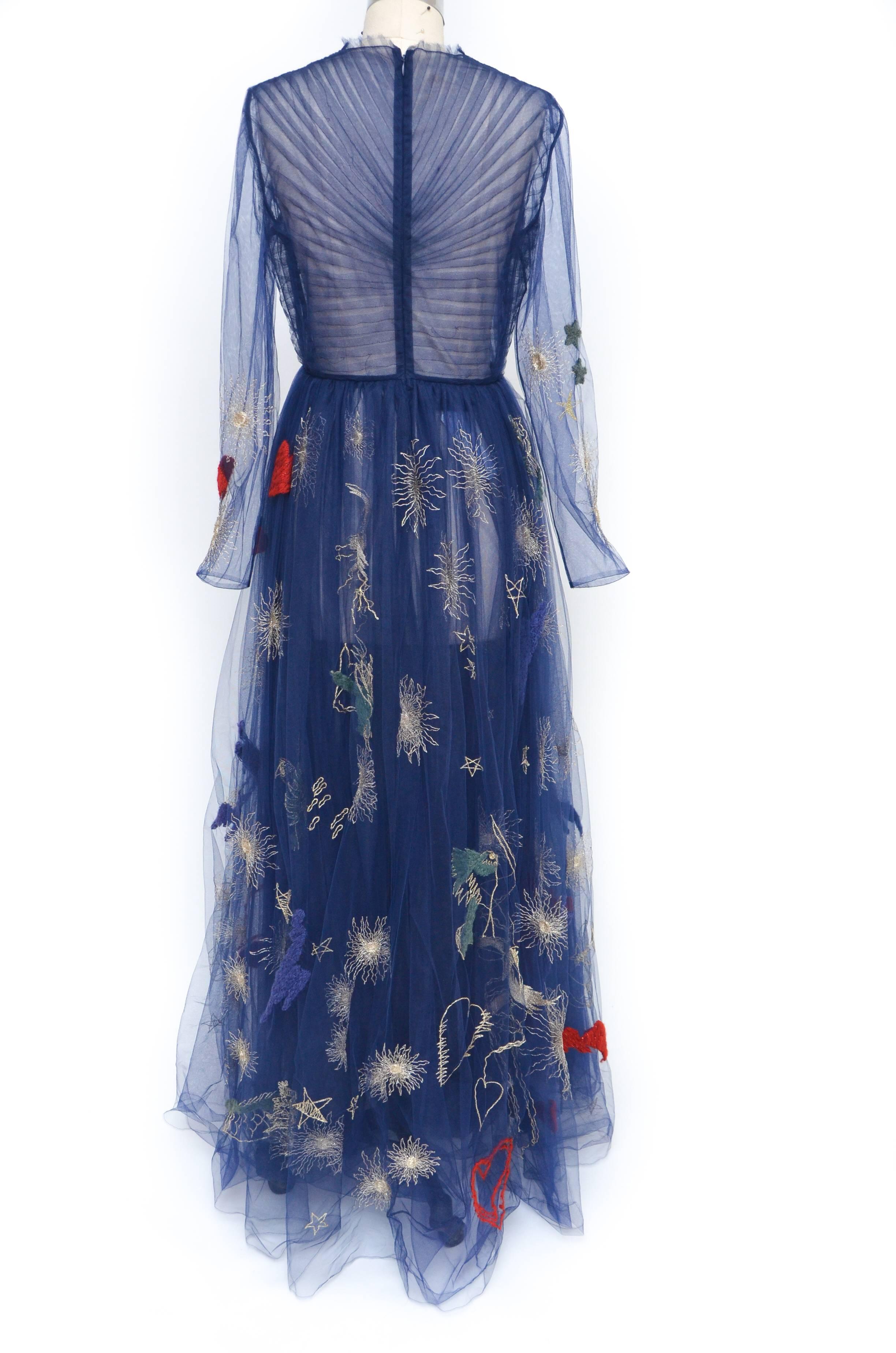 One of the most  coveted and most wanted  dress ever...
The embroidered tulle gown by Valentino is created of magical midnight navy tulle and with no further introductions, it is a vision.
The sheer bodice is gathered into a romantic red heart on