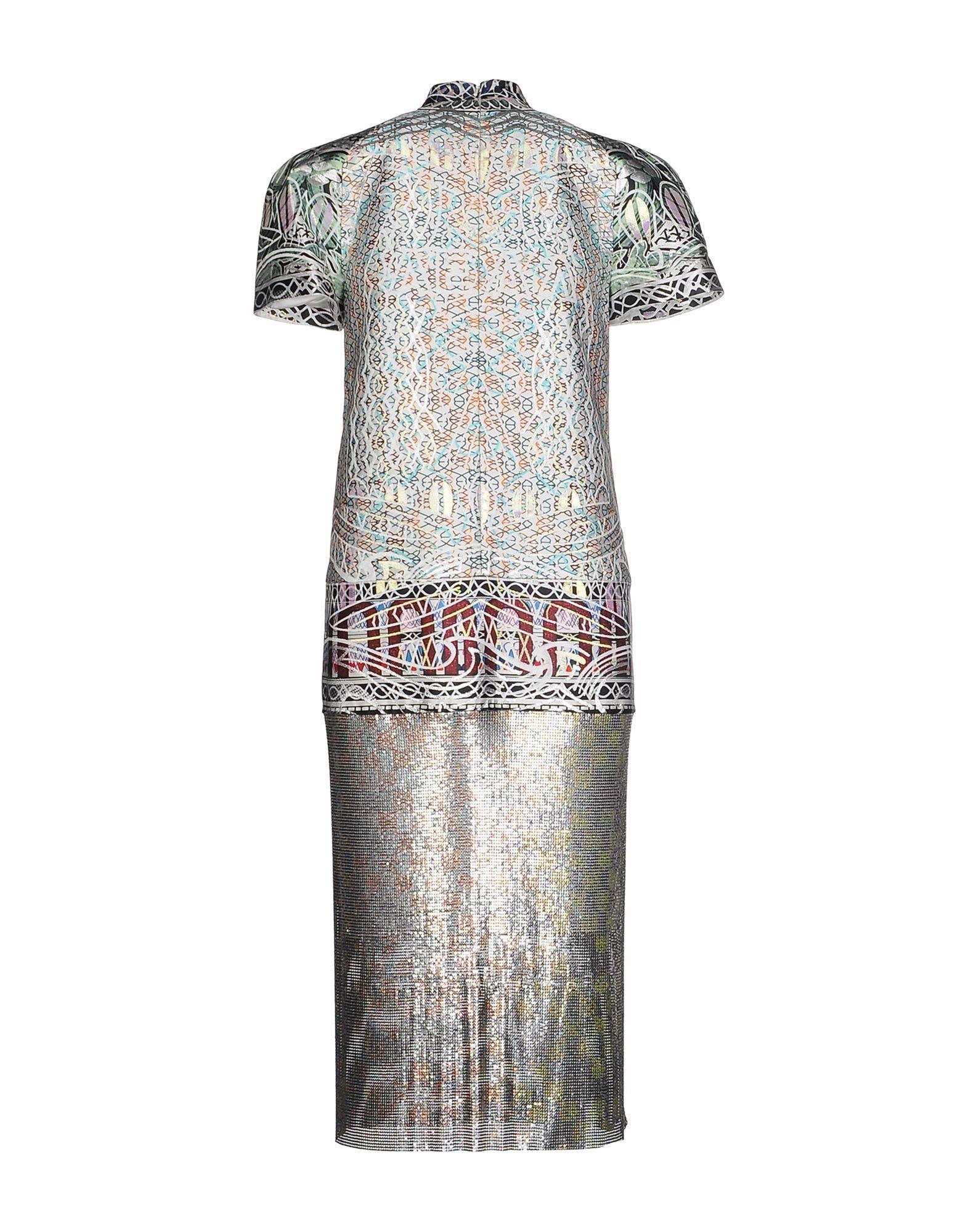 Mary Katrantzou continues to revolutionize feminine fashion with this intricately crafted 'Jigsaw' dress. 
The designer artfully combines metallic jacquard with hand-linked metal-mesh that has been printed with a Unique Heat Transfer Process.