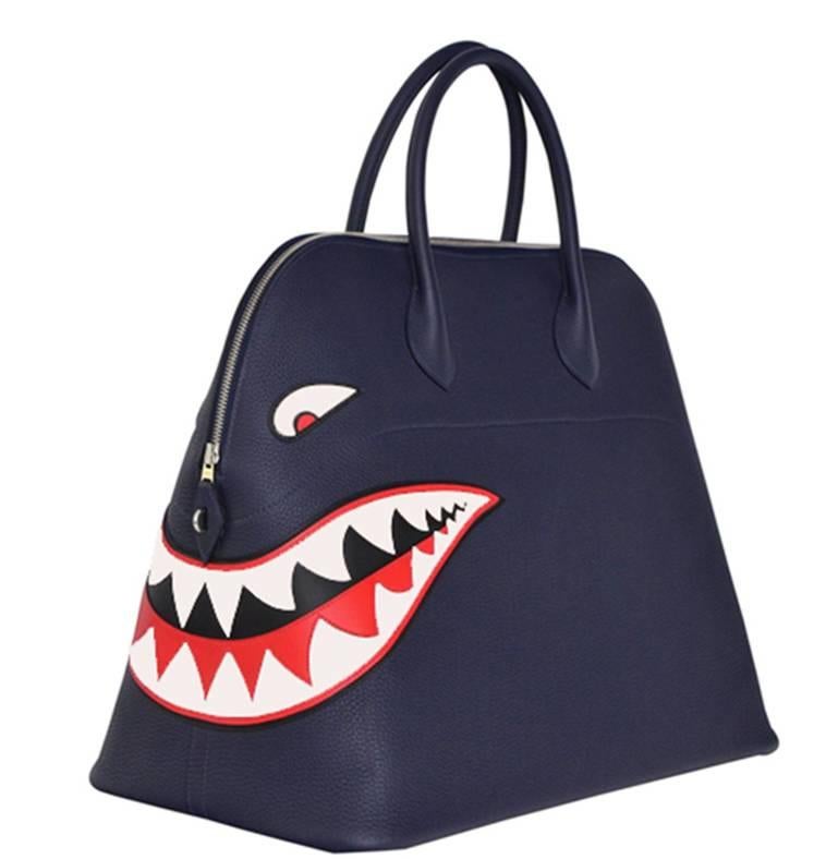 Exclusive and rare Hermes Shark Bolide handbag .
Brand new store fresh.
Limited edition from 2016.
Indigo togo leather with palladium hardware.
Bottom of the bag is lined in  leather,walls inside are partially lined in recognizable Hermes canvas and