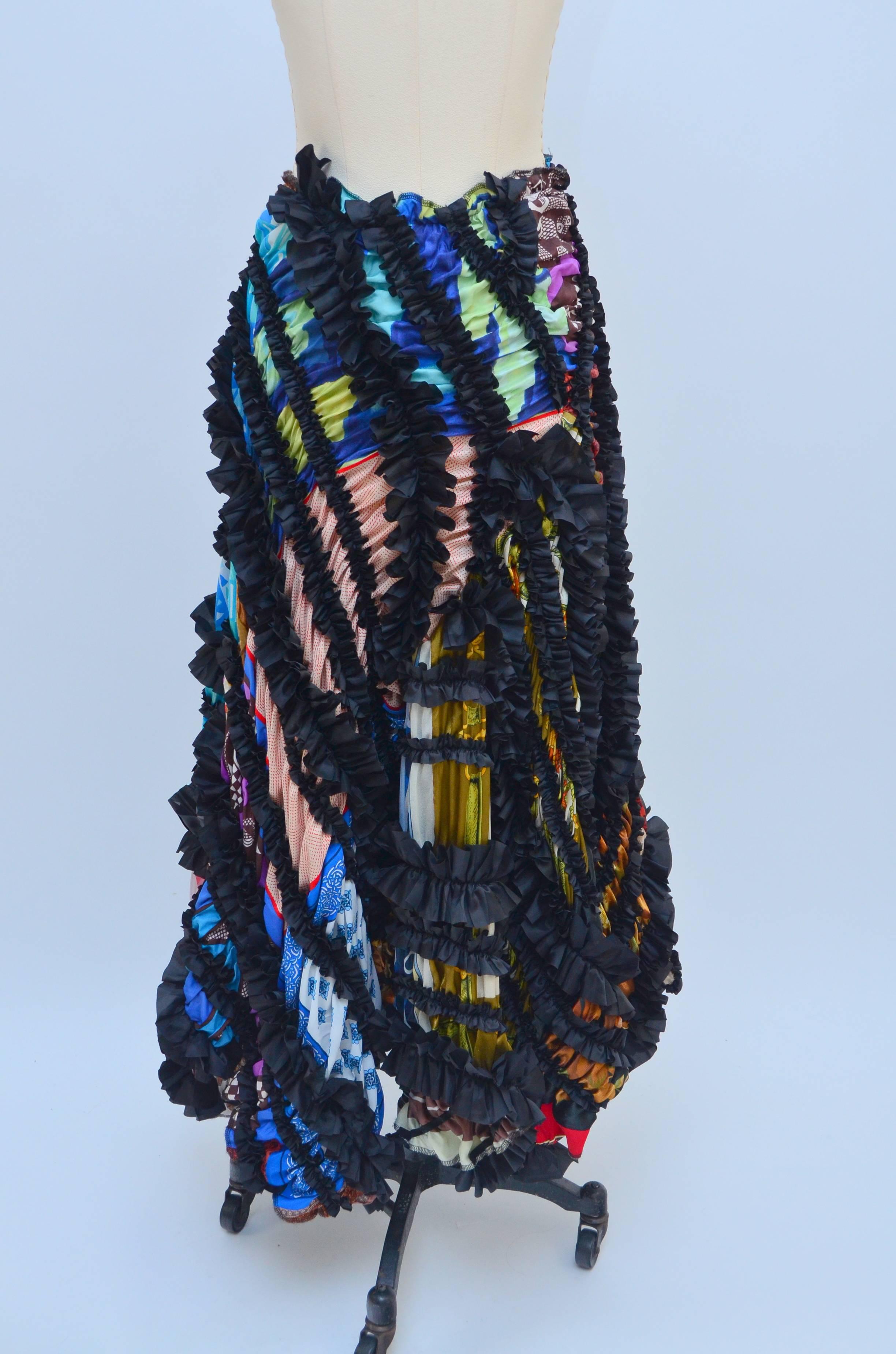 Comme Des Garçons runway 2011 skirt.
Very beautiful and rare skirt made of many different pieces of fabric and ribbon ruffles.
Uneven cut all the way around giving this beautiful skirt very unique and special look.
Excellent like new condition.
Size