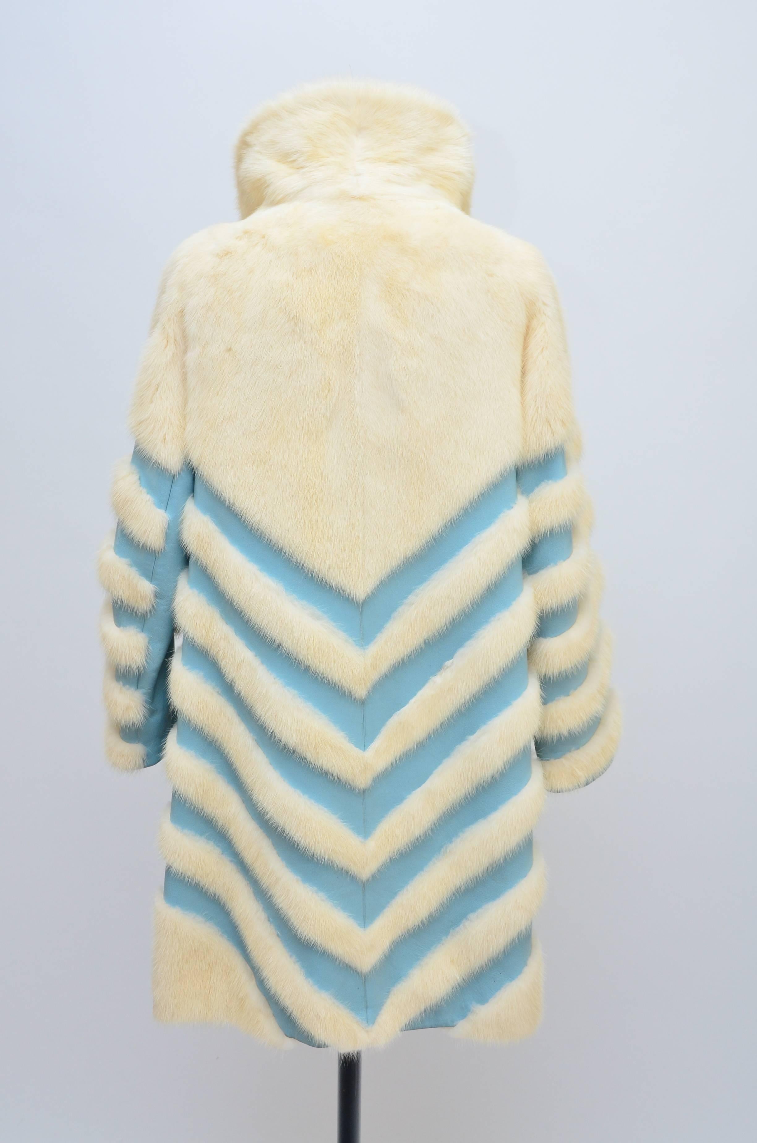 Amazing and rare Elsa Schiaparelli White mink blue leather 
Chevron Mod coat.
Excellent vintage condition.Please see pictures.....
Mink is in excellent condition .Lining is printed Schiaparelli and have few tiny marks as photographed.
Photographed