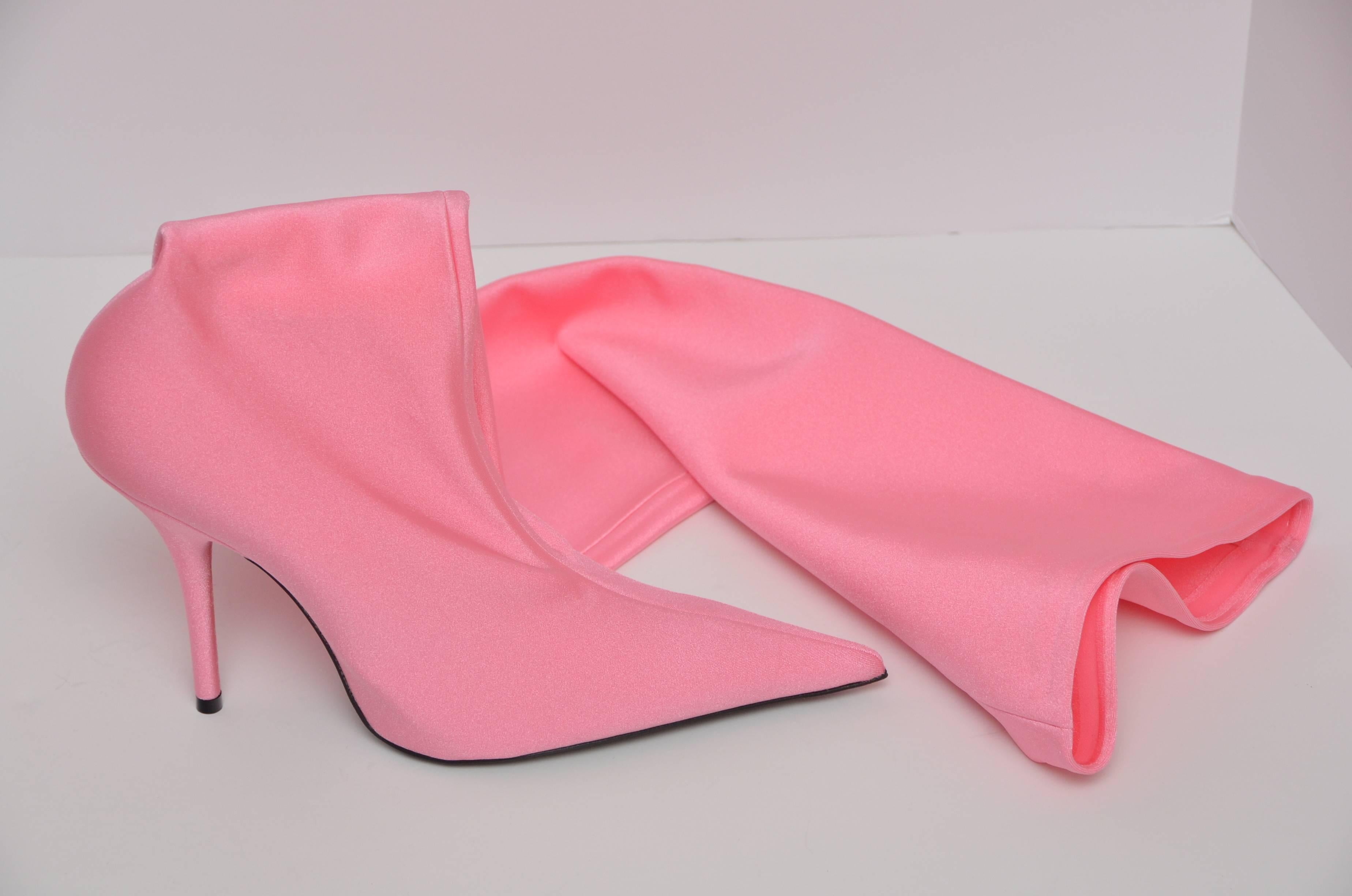 These pink  Balenciaga 'Knife' over-the-knee booties need no introduction. Fabricated in Italy and inspired by '80s sportswear, these thigh-high boots have been crafted from shiny and stretchable jersey and feature a flat point toe (inspired by a