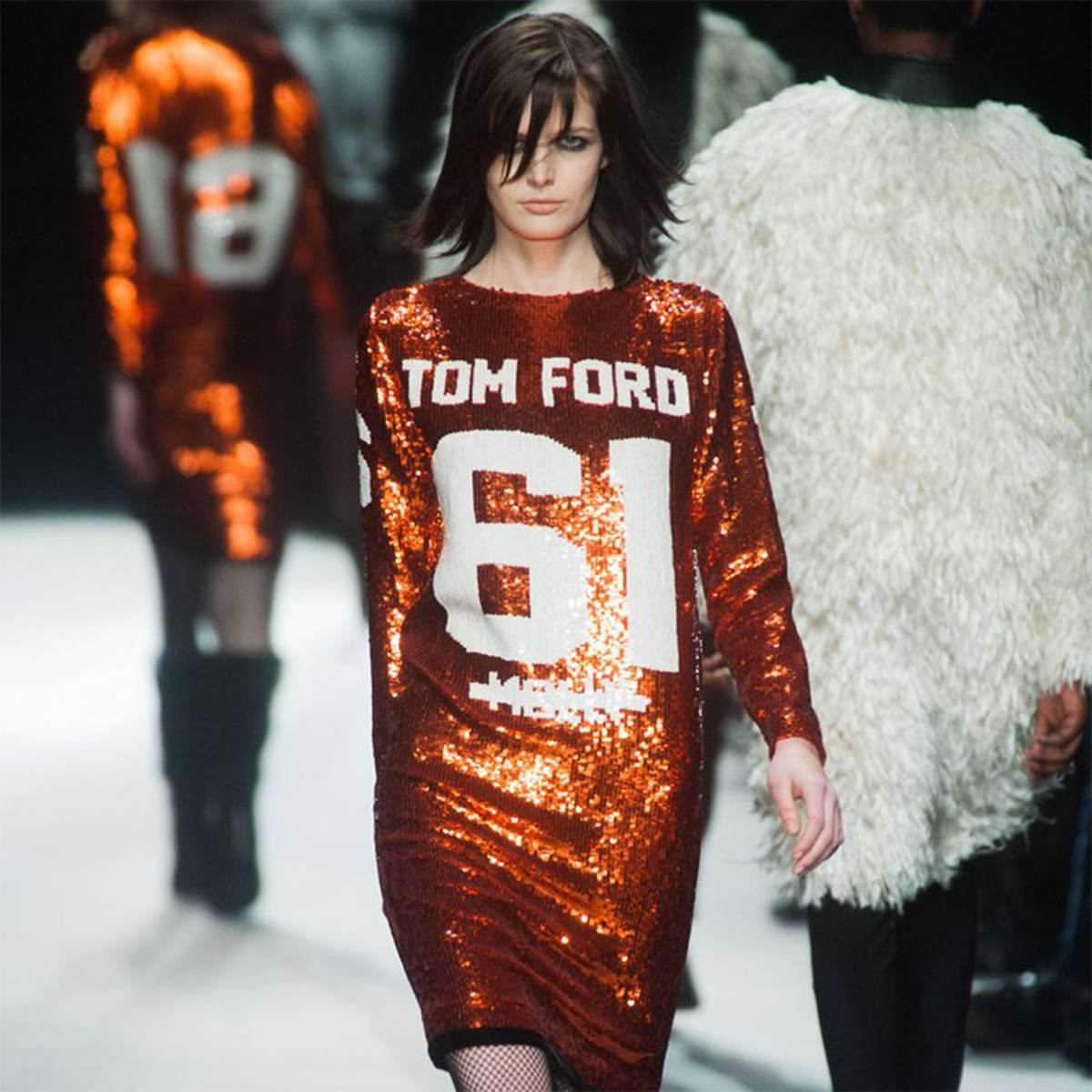 Tom Ford  sequin jersey dresses from of his SS14 collection.
The dress was designed as a tribute to Jay-Z and worn by Beyonce while on tour as a homage to Tom Ford.
This is exactly same dress as  the runway picture and color of the dress might look