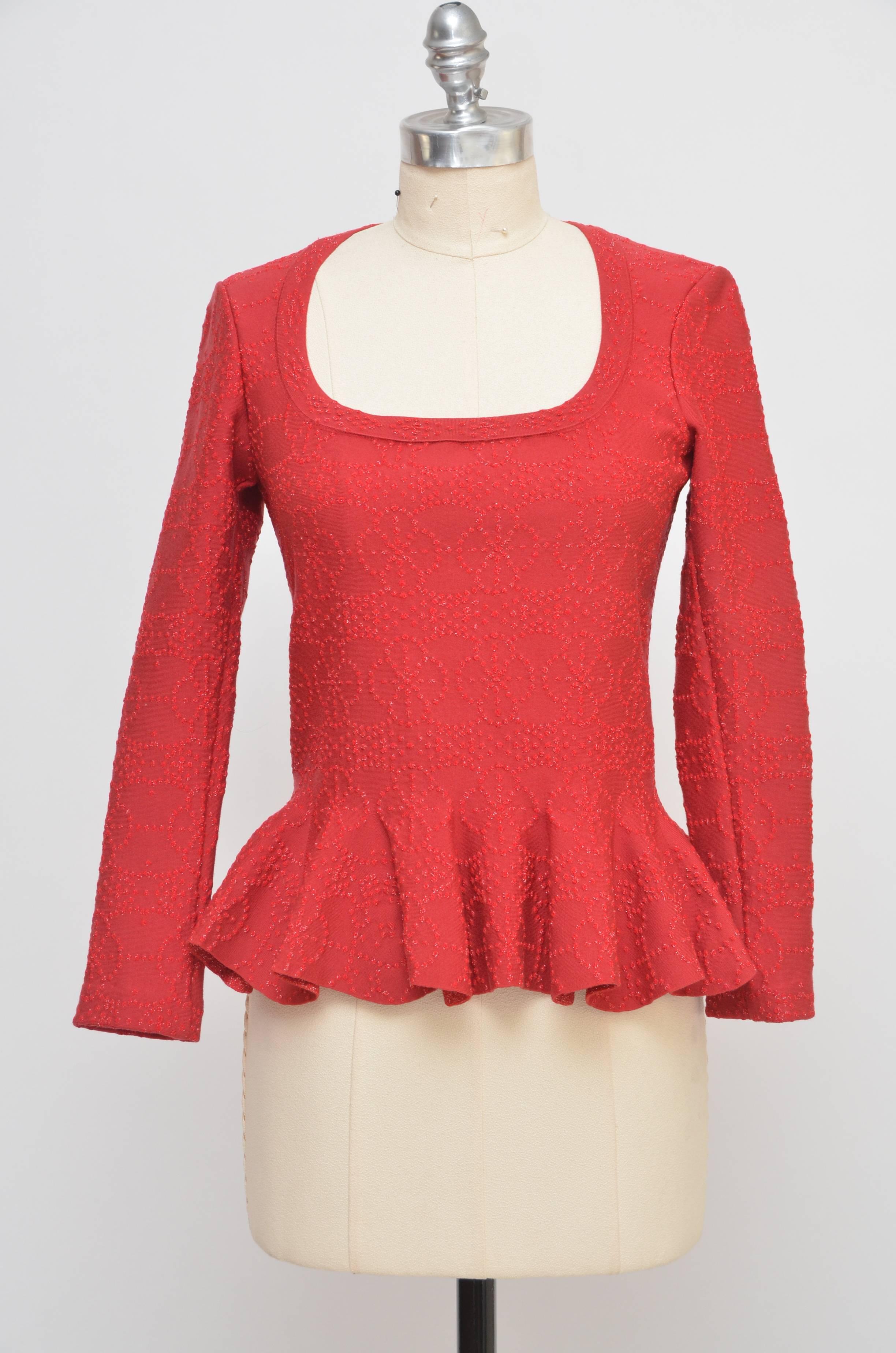 Alaia top .
Mail color: ruby red.Tag Size: 42.
Arabesque Motif featuring metallic embroidered sparkle textured pattern
Top features scoop neck, concealed zip at back, flounced  waist. 
W 31