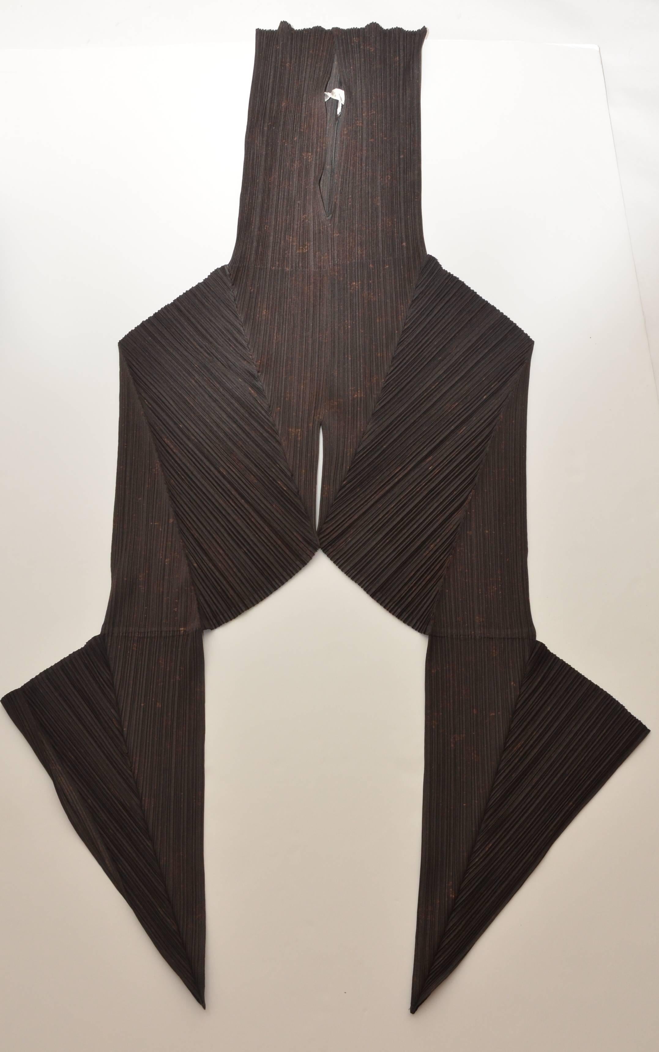 Issey Miyake Cai Guo-Qiang guest artist series No#4 Harem pants.
Dark brown color in person with gun powder  effect  printed on the fabric.
There are no zippers and pants are supposed to be tided up in the front.
Looks very 