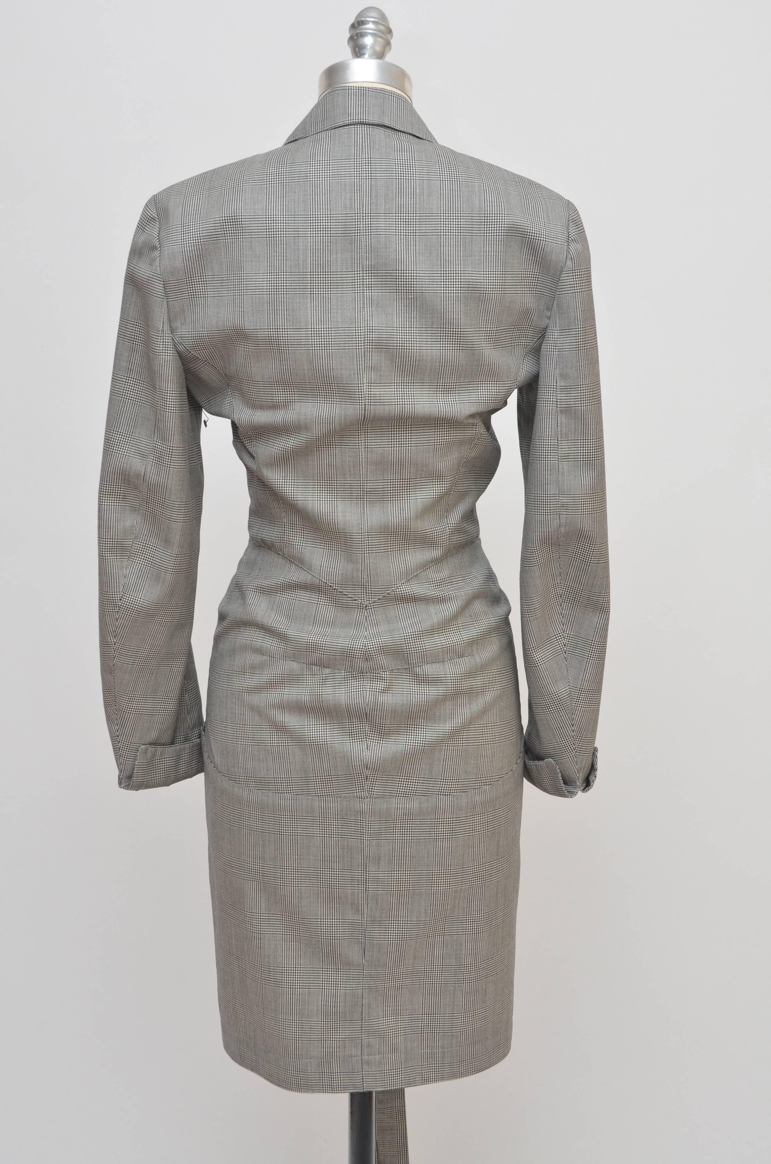 Rare Alaia wool mini dress photographed  on Naomi Campbell with Alaia .
Drawstring fastening, two front pockets one on the top, pointed collar and double button closures. 
Autumn Winter 1988
Excellent mint vintage condition.No holes, rips or stains