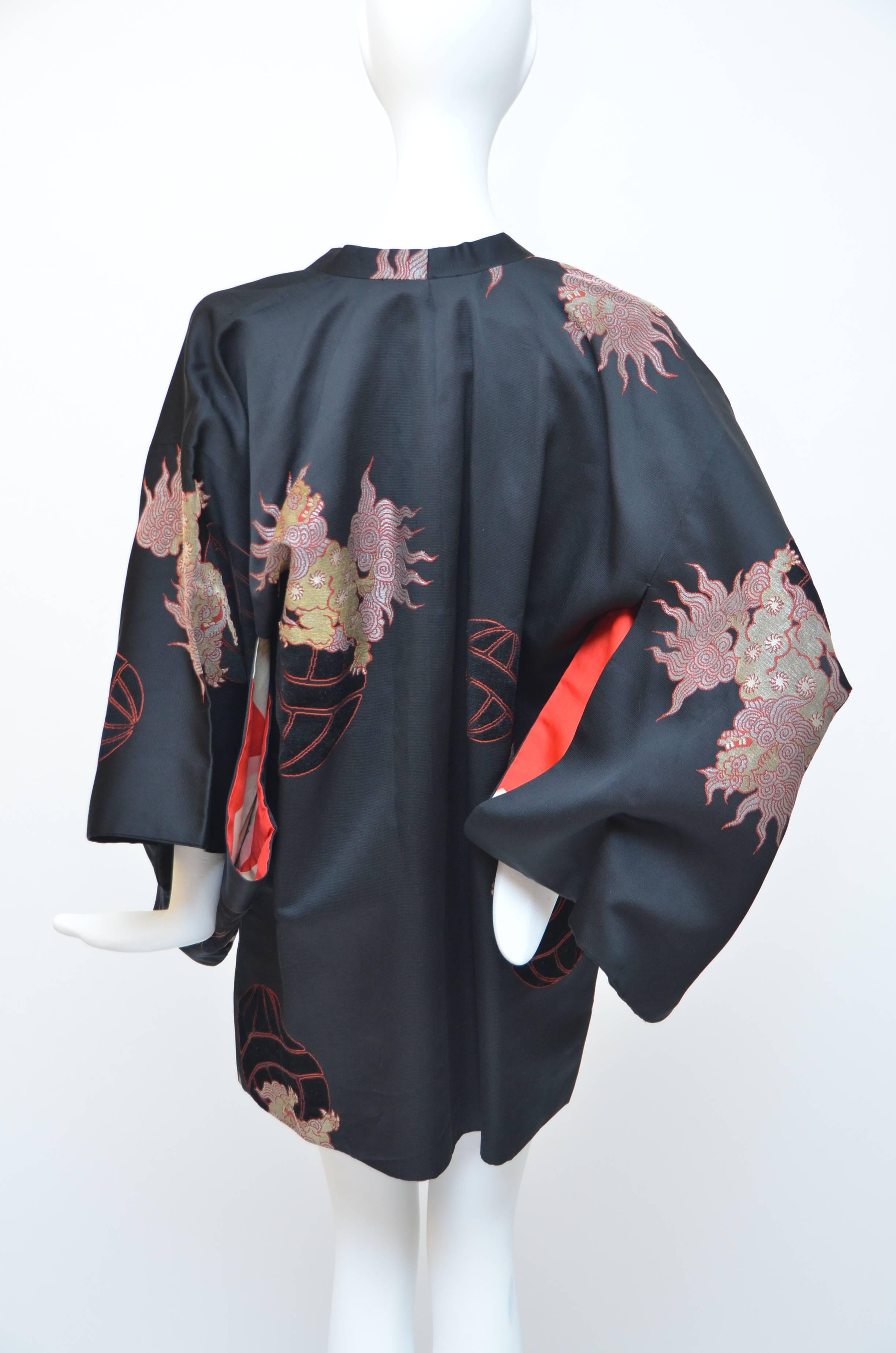 Christian Dior kimono with dragoon print.
Very good condition.
Hidden snaps closure at front.   
Fabric content unknown, feels like a medium-weight, very slightly ribbed, silky synthetic.  
Made in France.  No size label. 
Size is somewhat flexible,