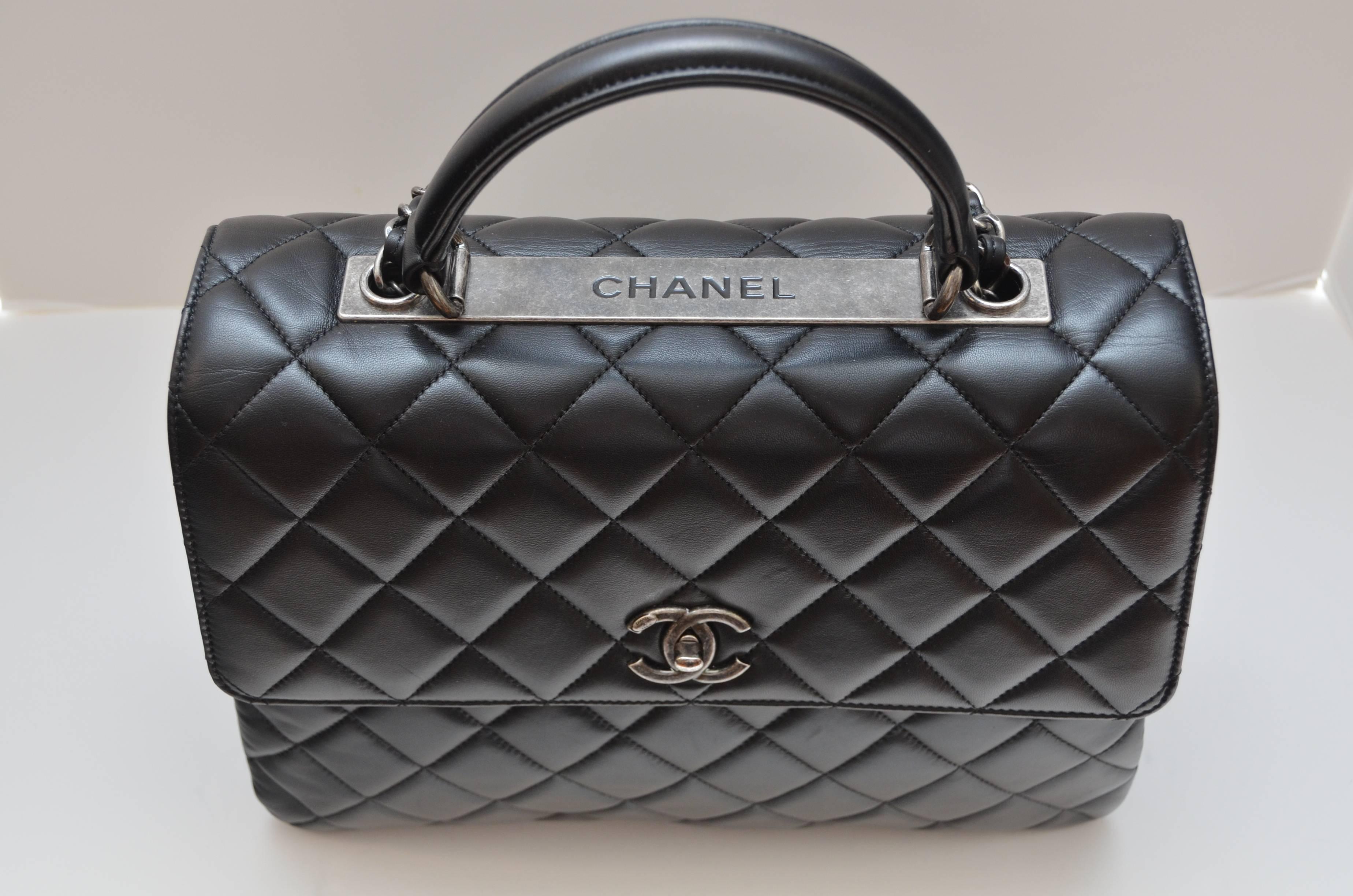 Chanel Black Large Trendy CC Classic Handle Shoulder Flap Tote Bag retailed for $7,000 USD plus tax in stores .
Ornate, stylish and practical at the same time, the bag features Chanel's classic soft lambskin quilting, the classic turnlock CC