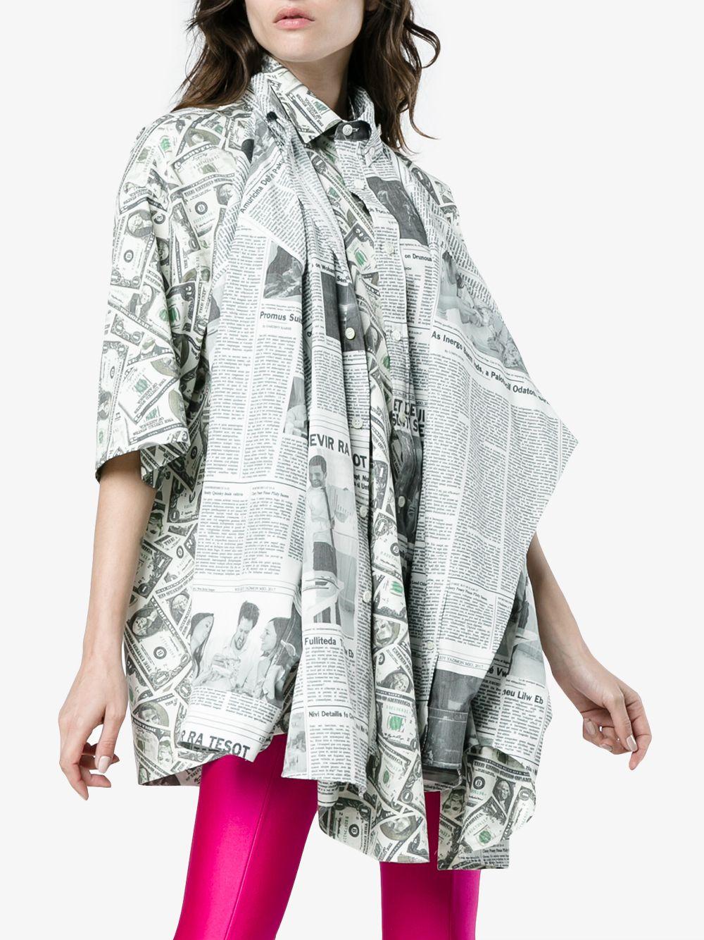 Balenciaga oversized long sleeve poplin shirt featuring  dollar and newspaper  graphic pattern.
Runway model.Its actually a double shirt:Dollar print side can be worn as short sleeve with newspaper print sleeves hanging in the front and newspaper