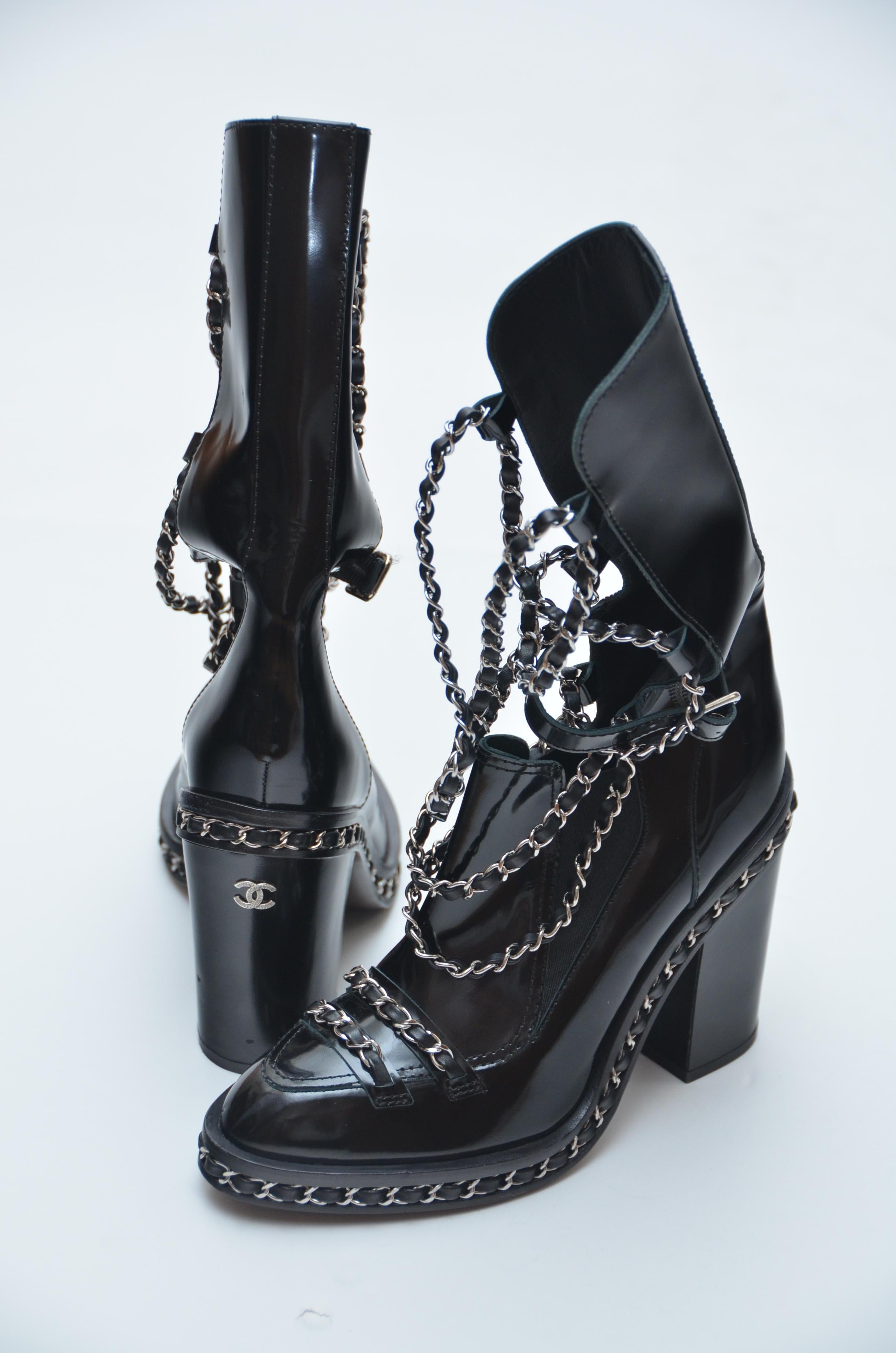 Chanel black chain boots.
Sold out fast and one of the most popular boots from Chanel.
Size 37.5 Please know /familiarize your self with Chanel boots  sizing since these are FINAL SALE  .I believe they run little small.

Excellent condition like New
