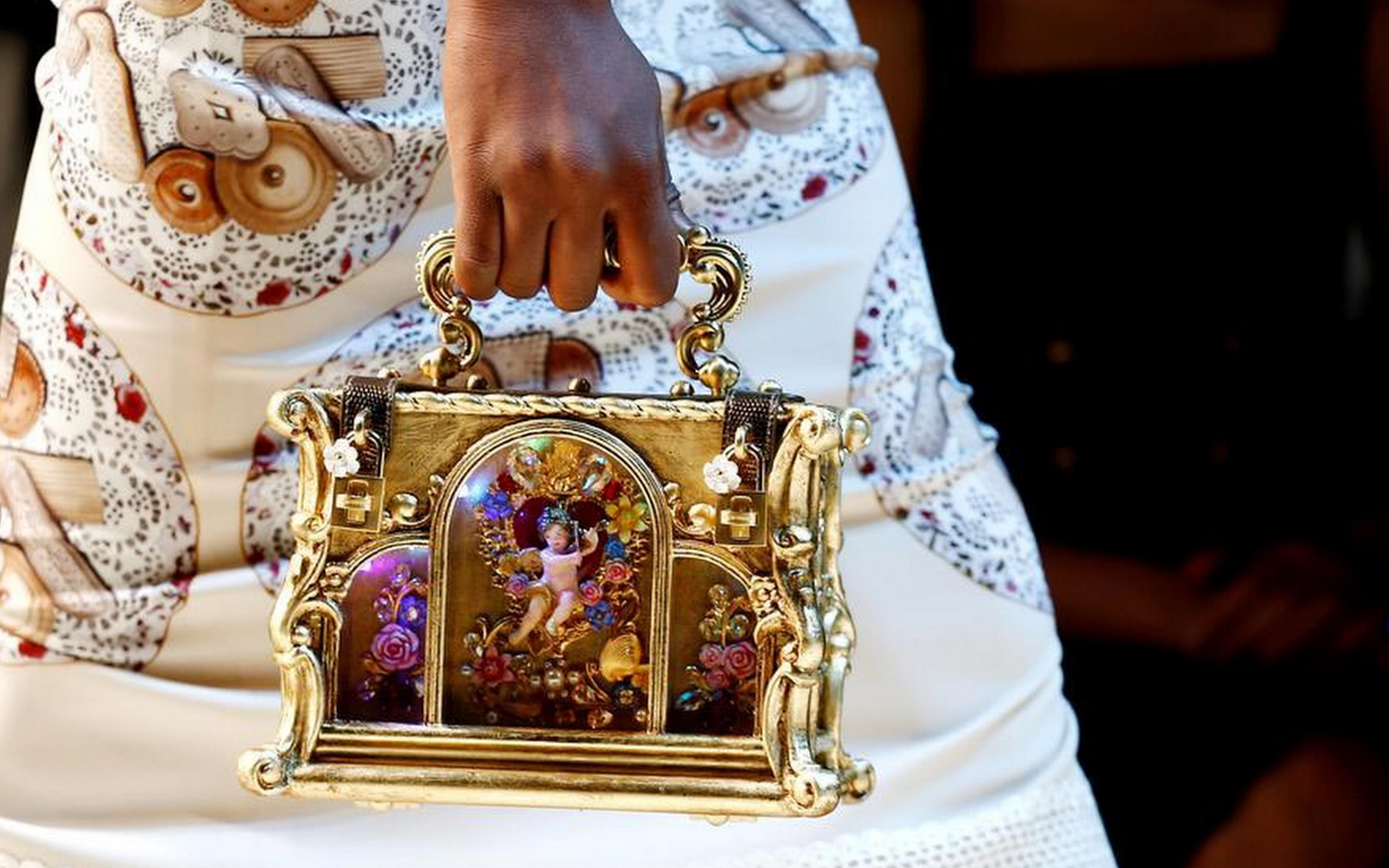 Extremely rare and limited Dolce & Gabbana Angel gold-tone boxy miniature tote bag. 
 With its opulent metallic sheen and intricate array of engraved florals, curls and flicks, it's reminiscent of an antique jewellery box and with glass panelled
