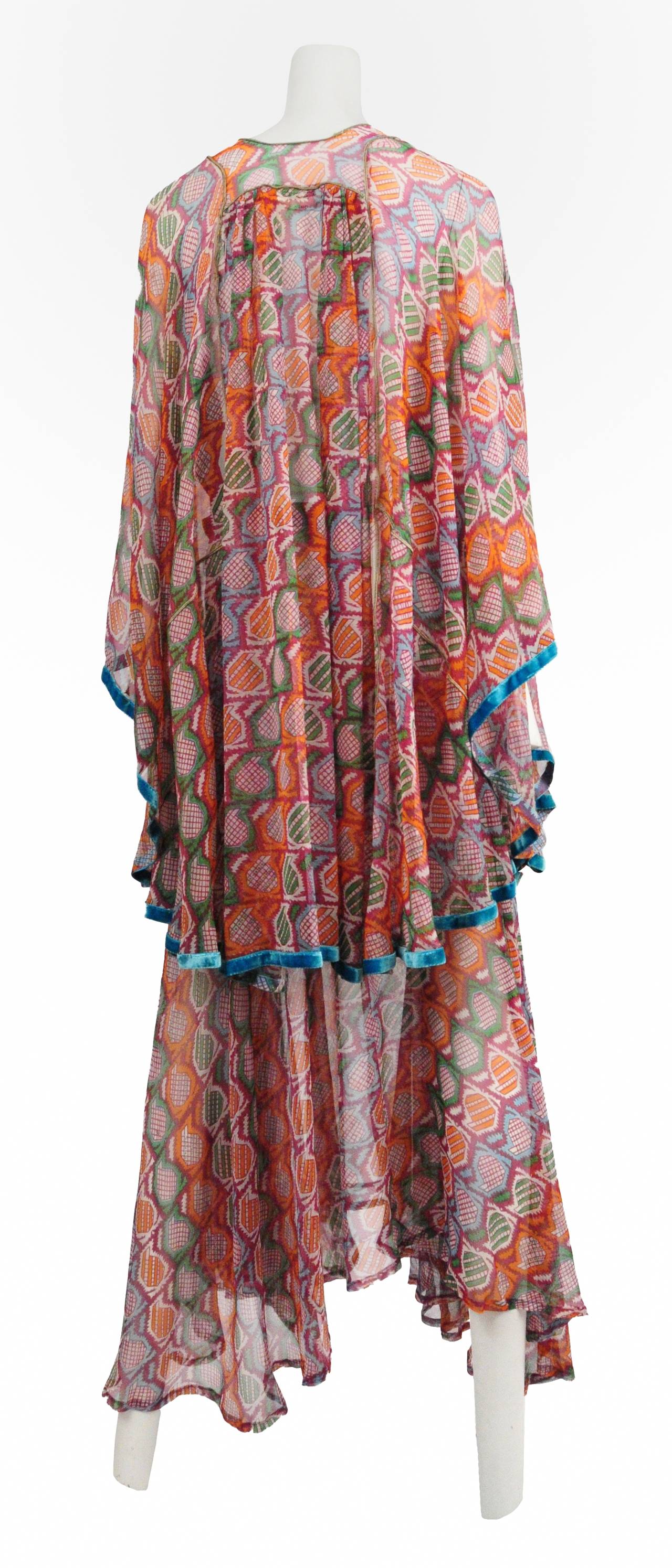 Vintage Thea Porter mixed print two piece ensemble with caftan style top paired with handkerchief hem skirt.