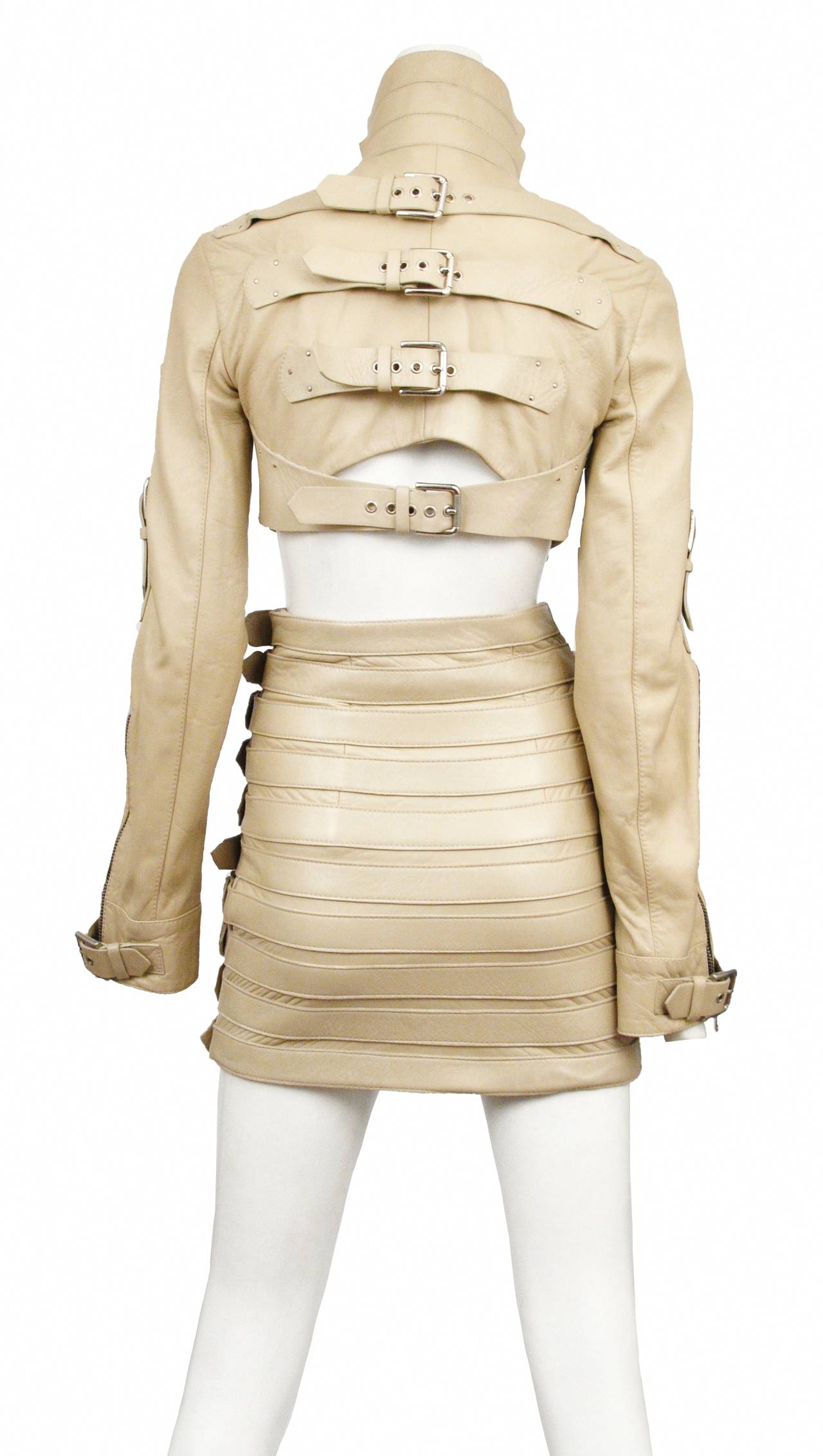 Vintage Dolce and Gabbana light tan leather bondage buckle jacket paired with matching high waisted skirt.