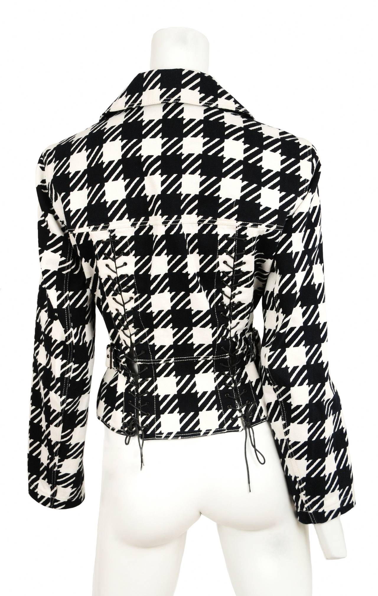 Vintage Alaia Black and white tati double breasted jacket with corseted lace up detail at back. Wide lapel and front zip flap pockets.