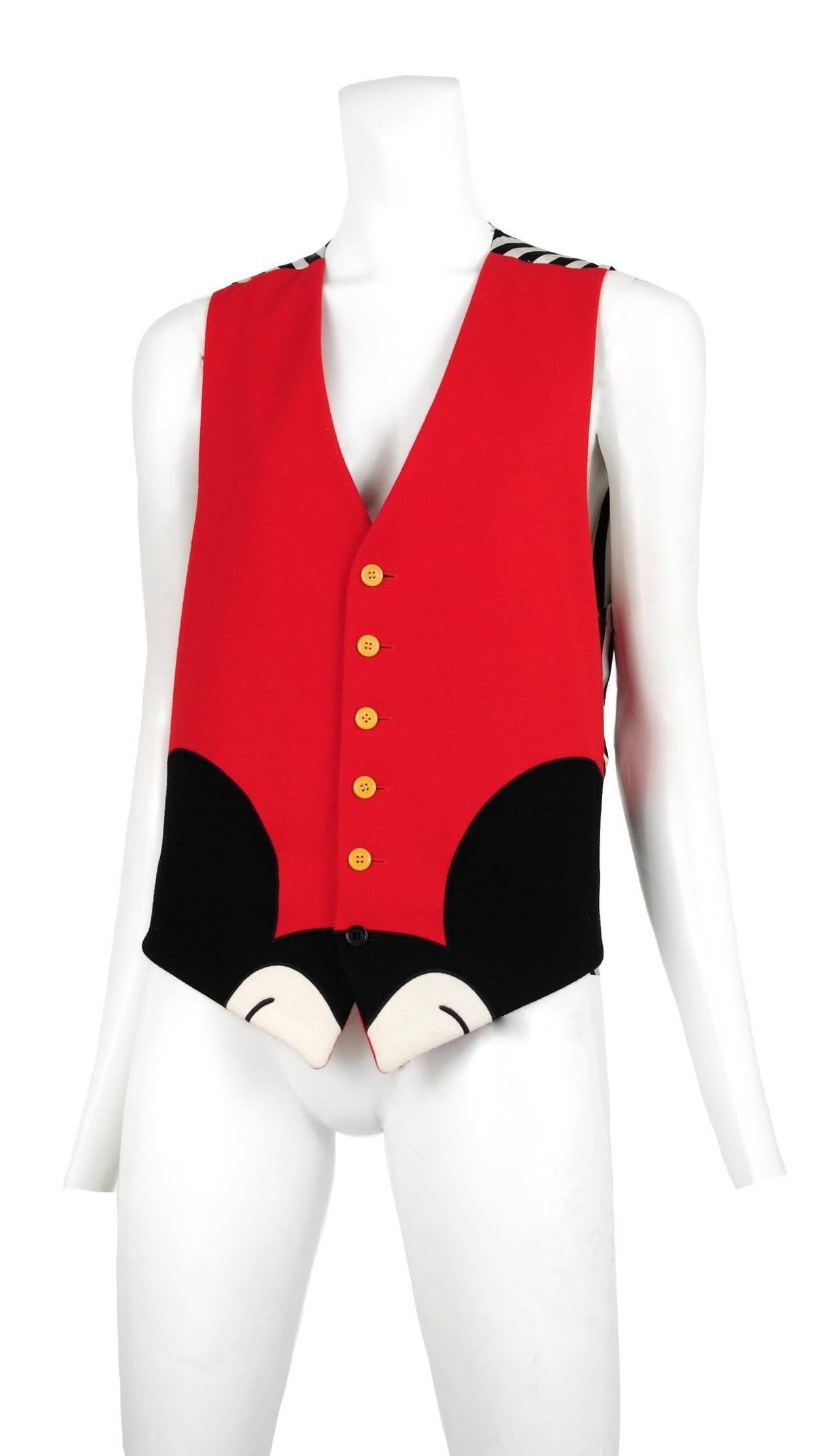 Vintage Moschino red wool vest with Mickey Mouse ear detail at bottom and black and white silk striped back.
